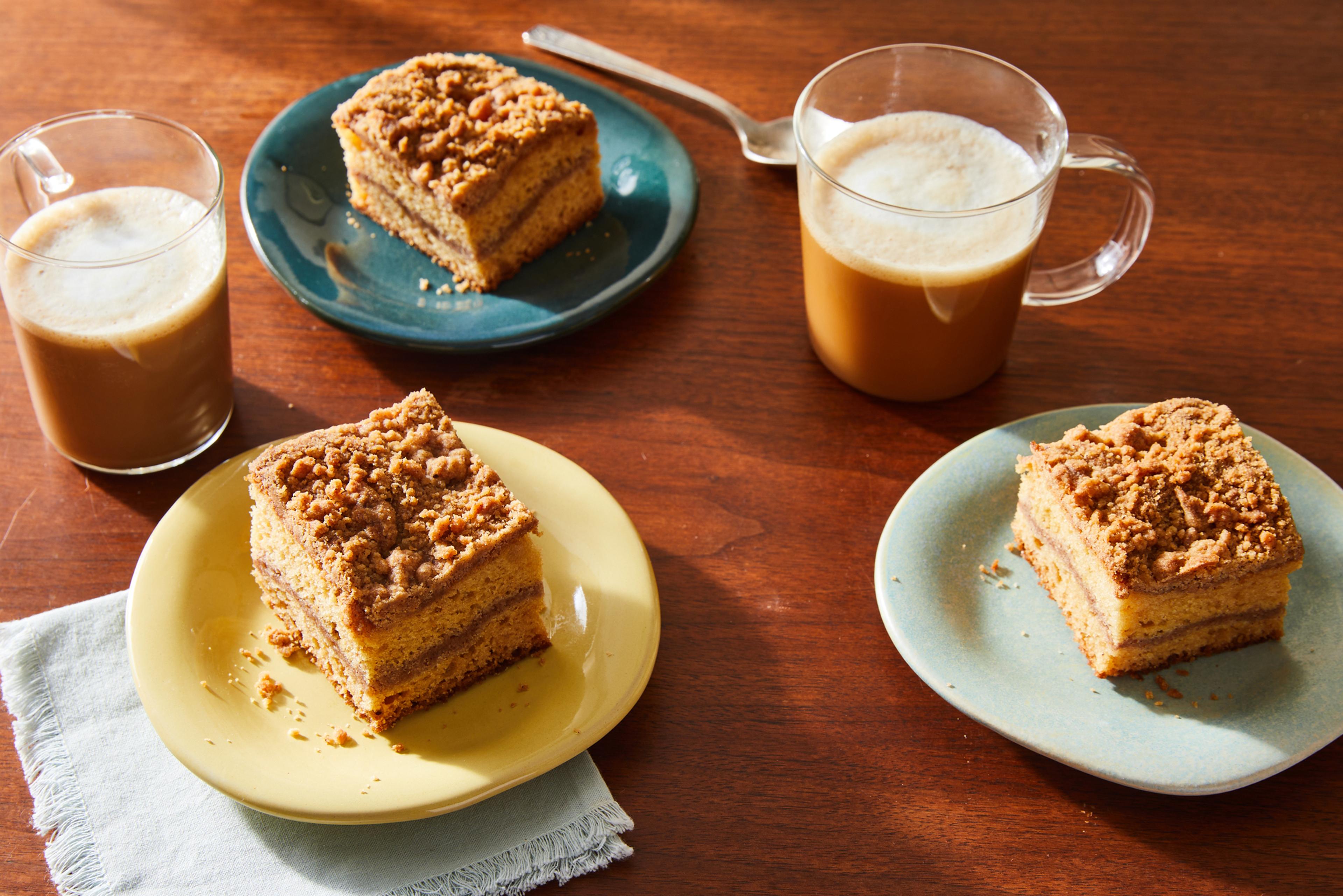 pumpkin spice lattes and coffee cake on table