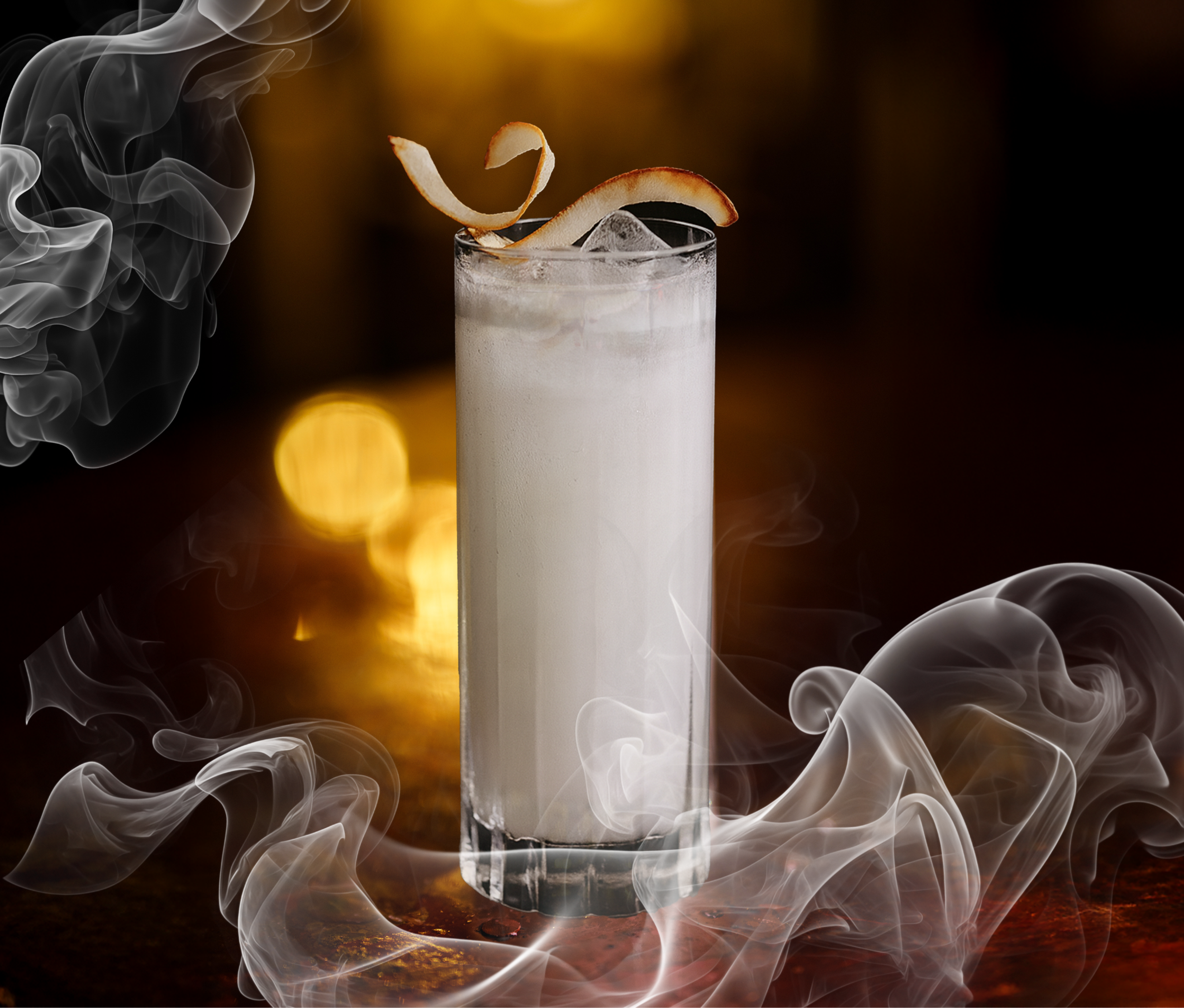 white coconut cocktail in high ball glass