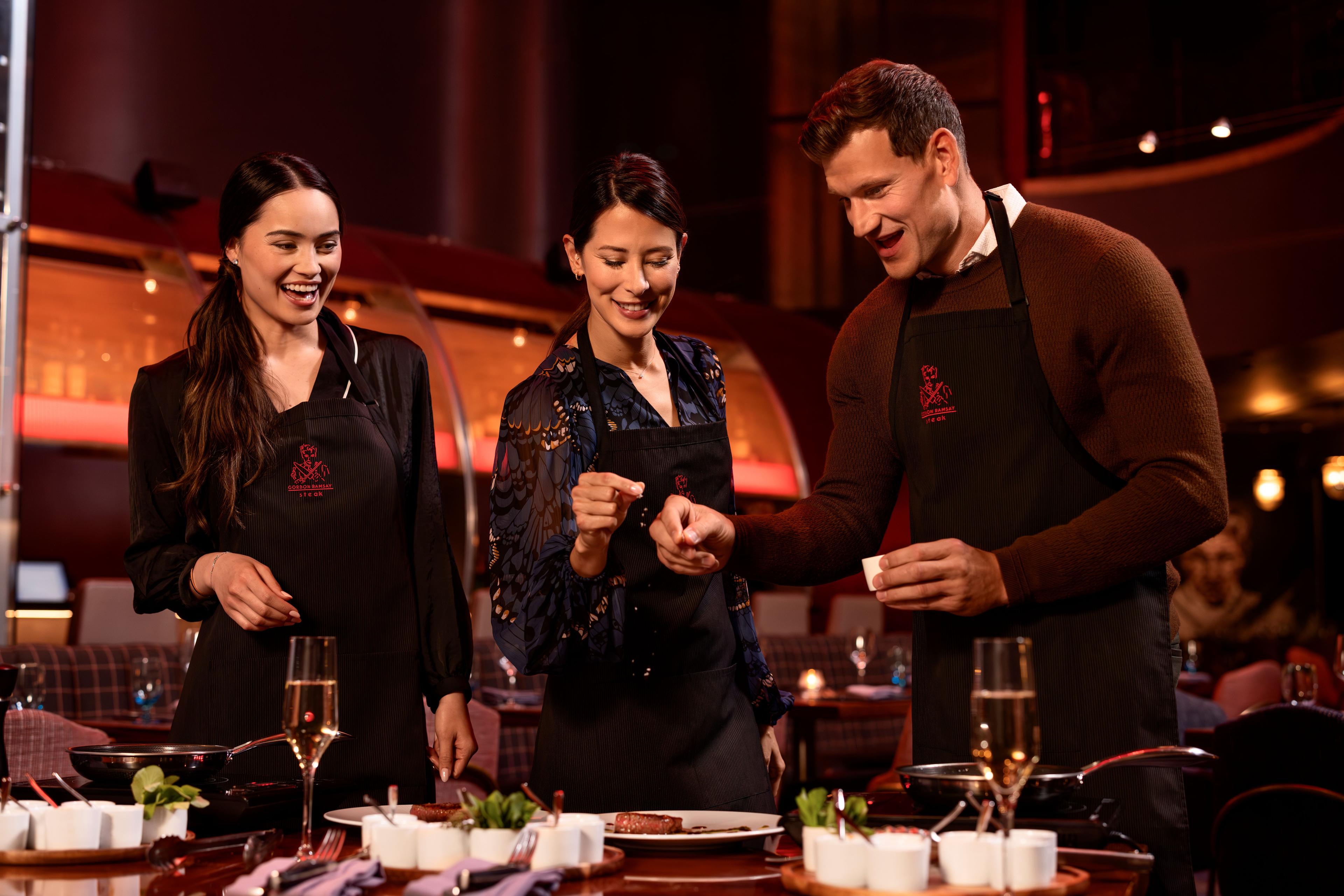 people cooking steak inside Gordan Ramsey Steak at Paris Las Vegas