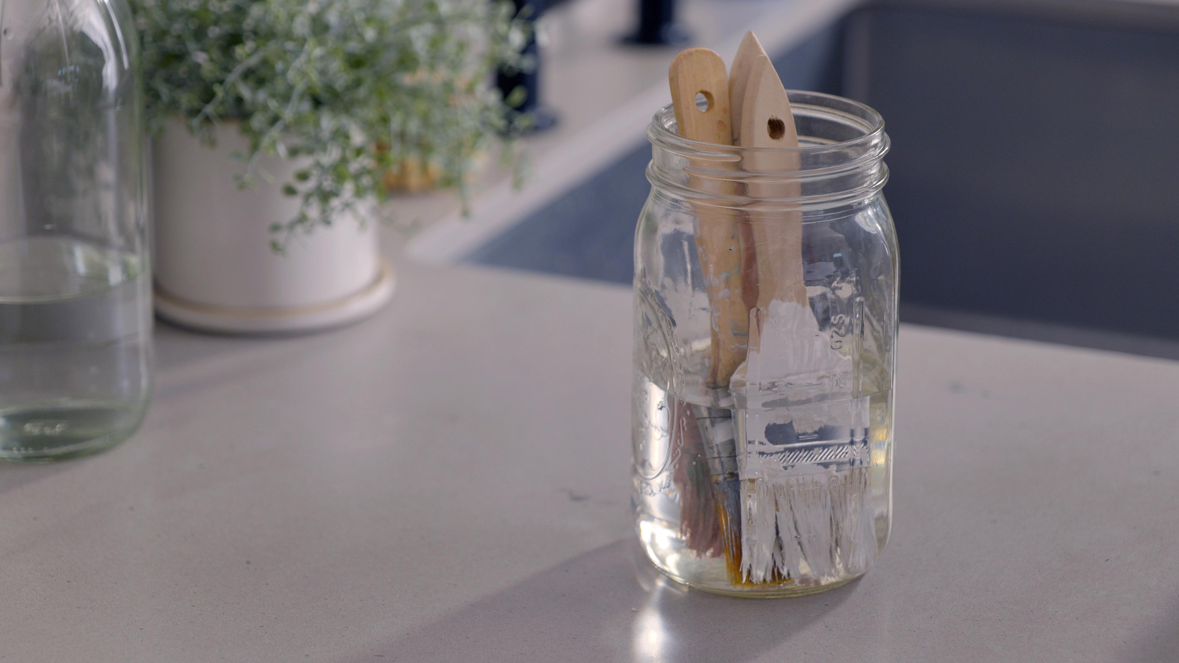paintbrushes in water
