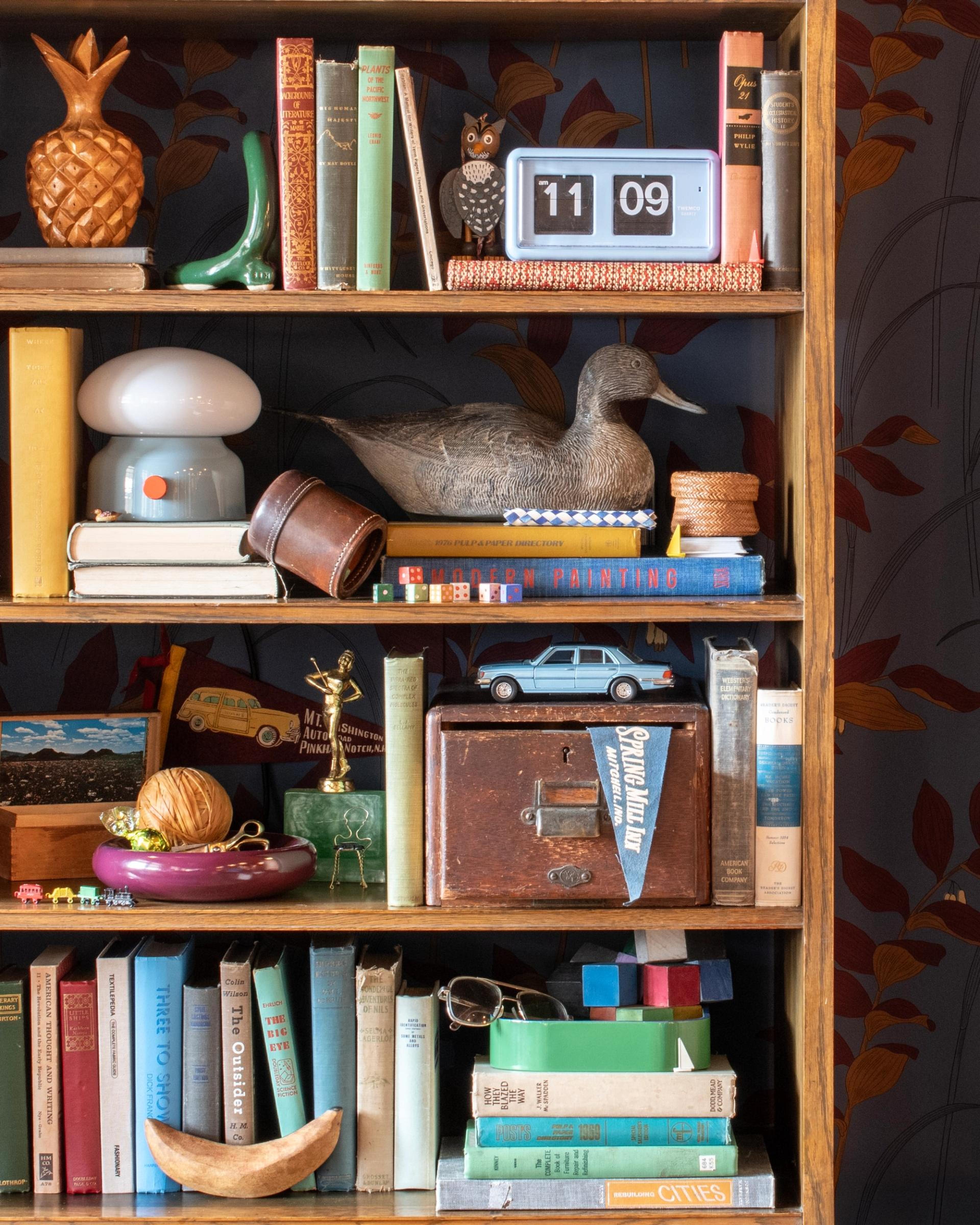 assorted vintage and new knick knacks on wooden shelf from Schoolhouse Electric