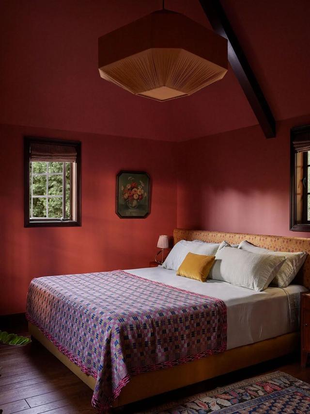 bed in burgundy room