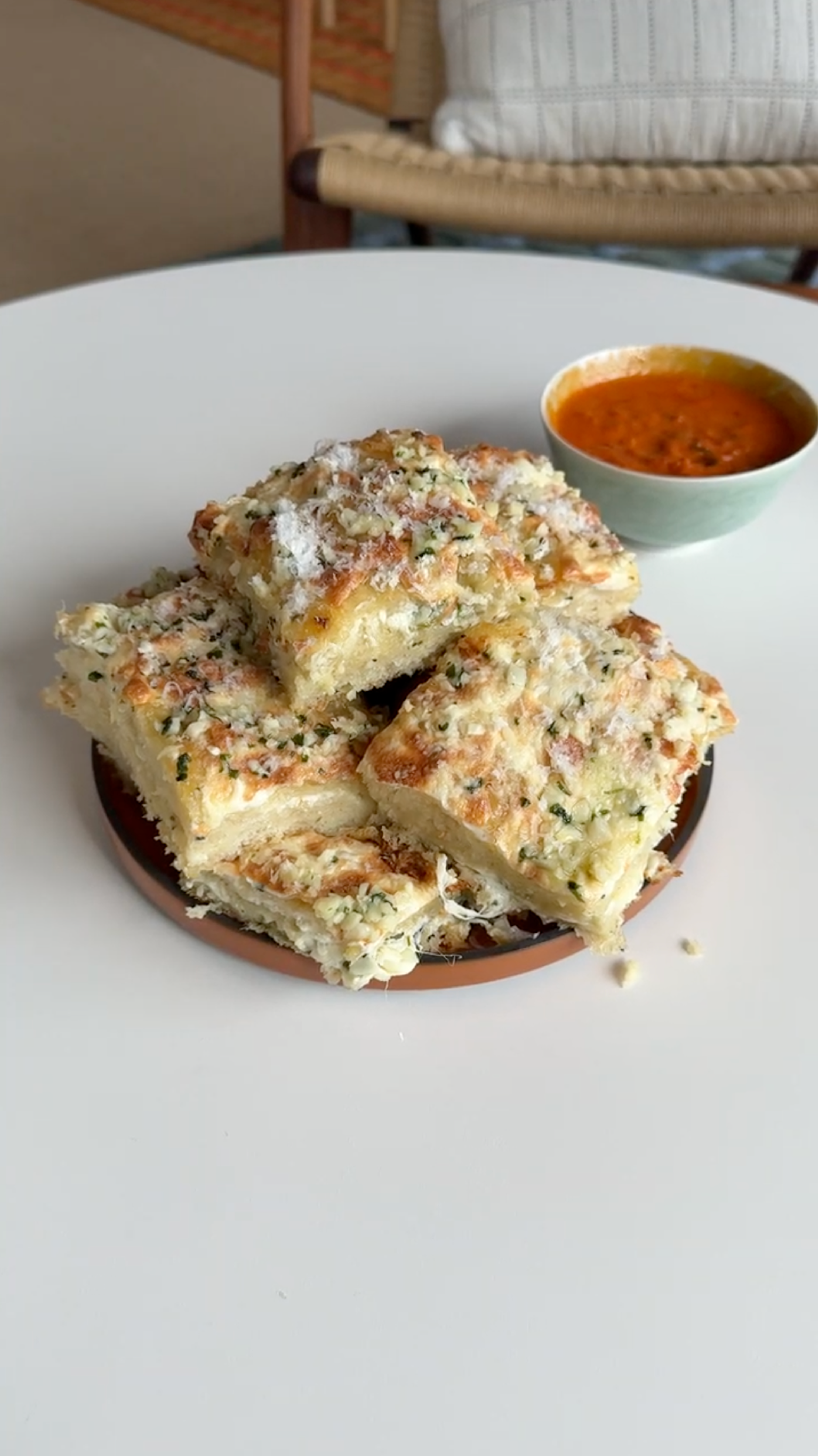 plate of homemade cheesy, garlicky foccacia  bread