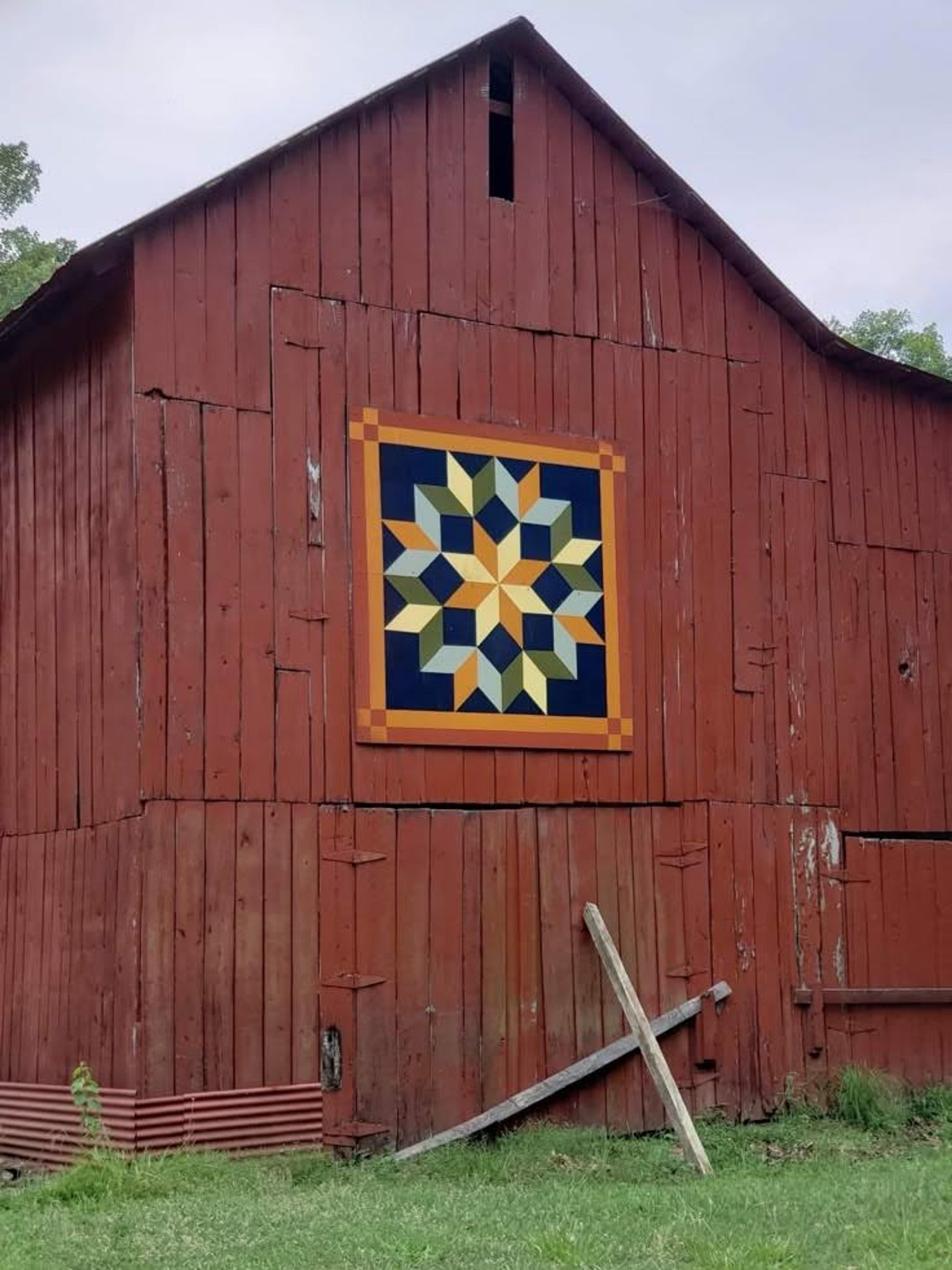 red barn with quilt like patch