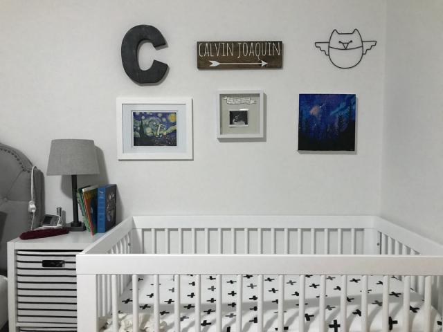 nursery sectioned off next to bed