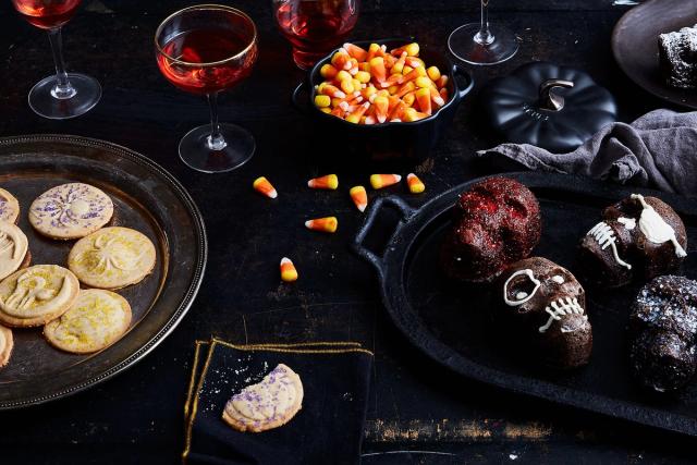 A dark table filled with spooky treats.