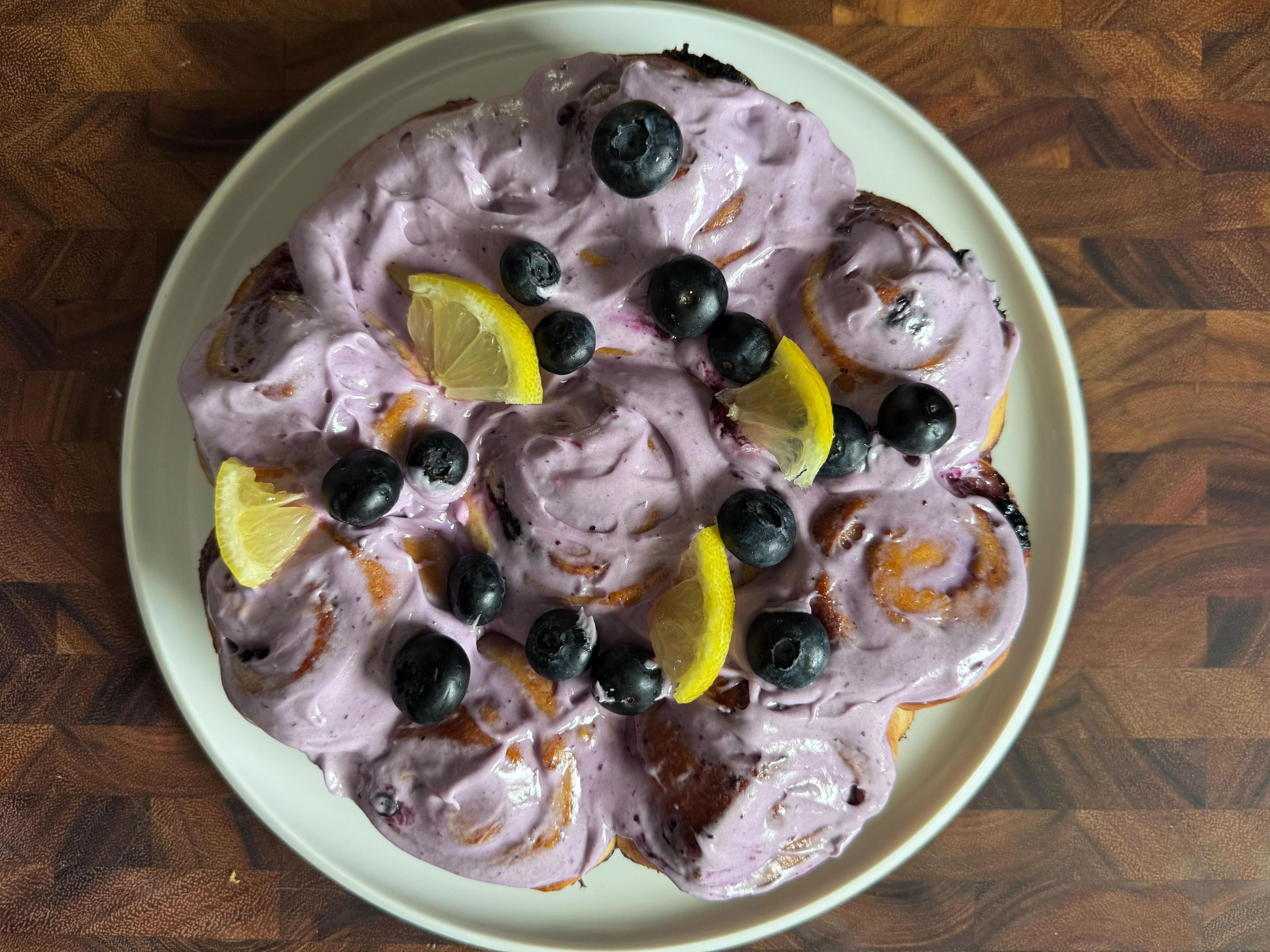 plate of homemage blueberry lemon frosted sweet rolls