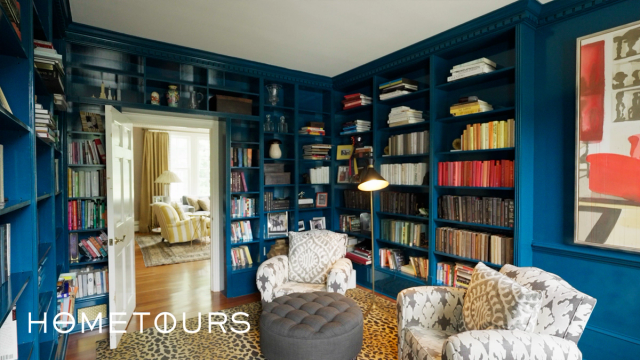 inside library and sitting are in Julia Brown's Millbrook home