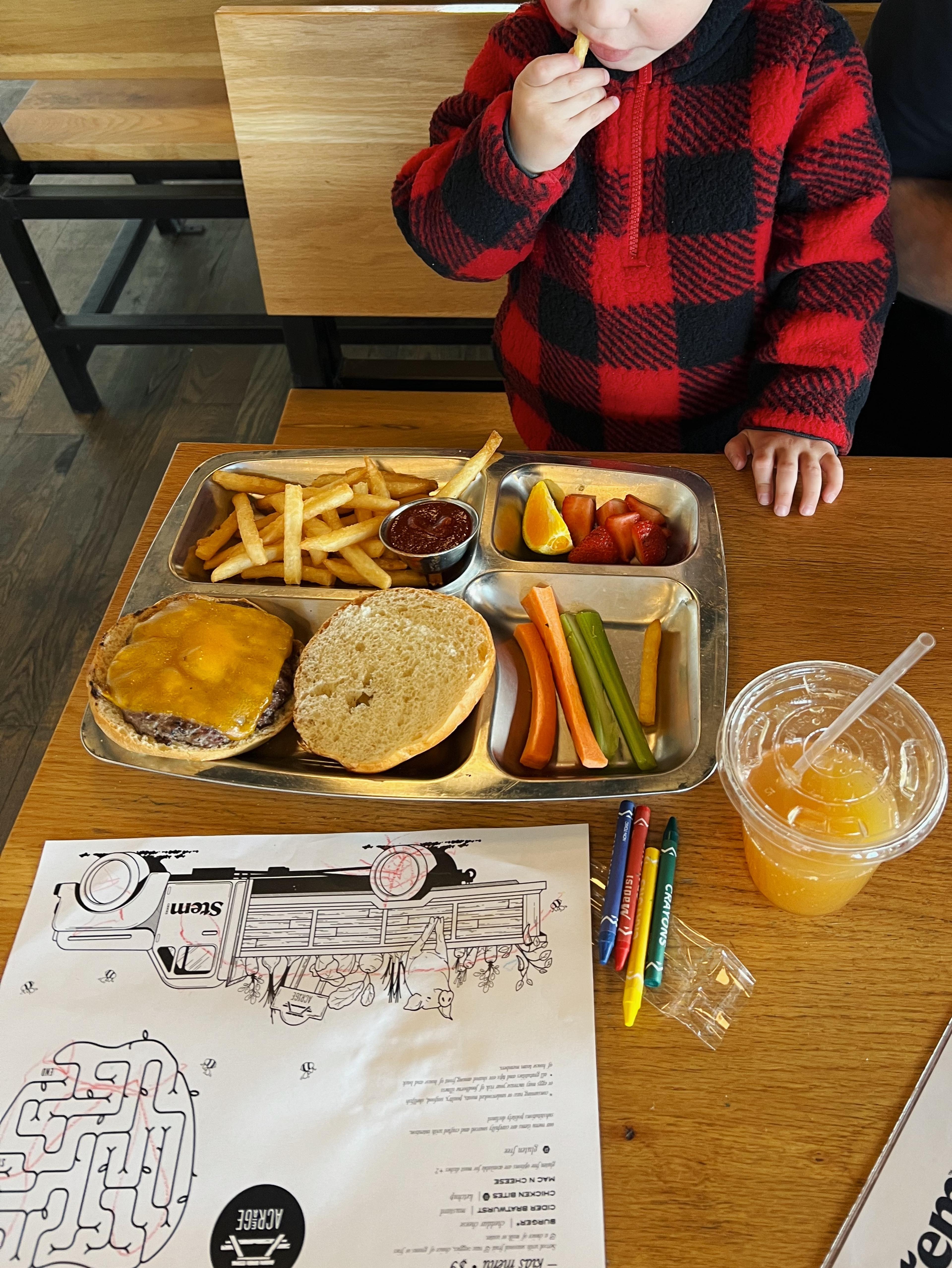 kid drawing at dinner