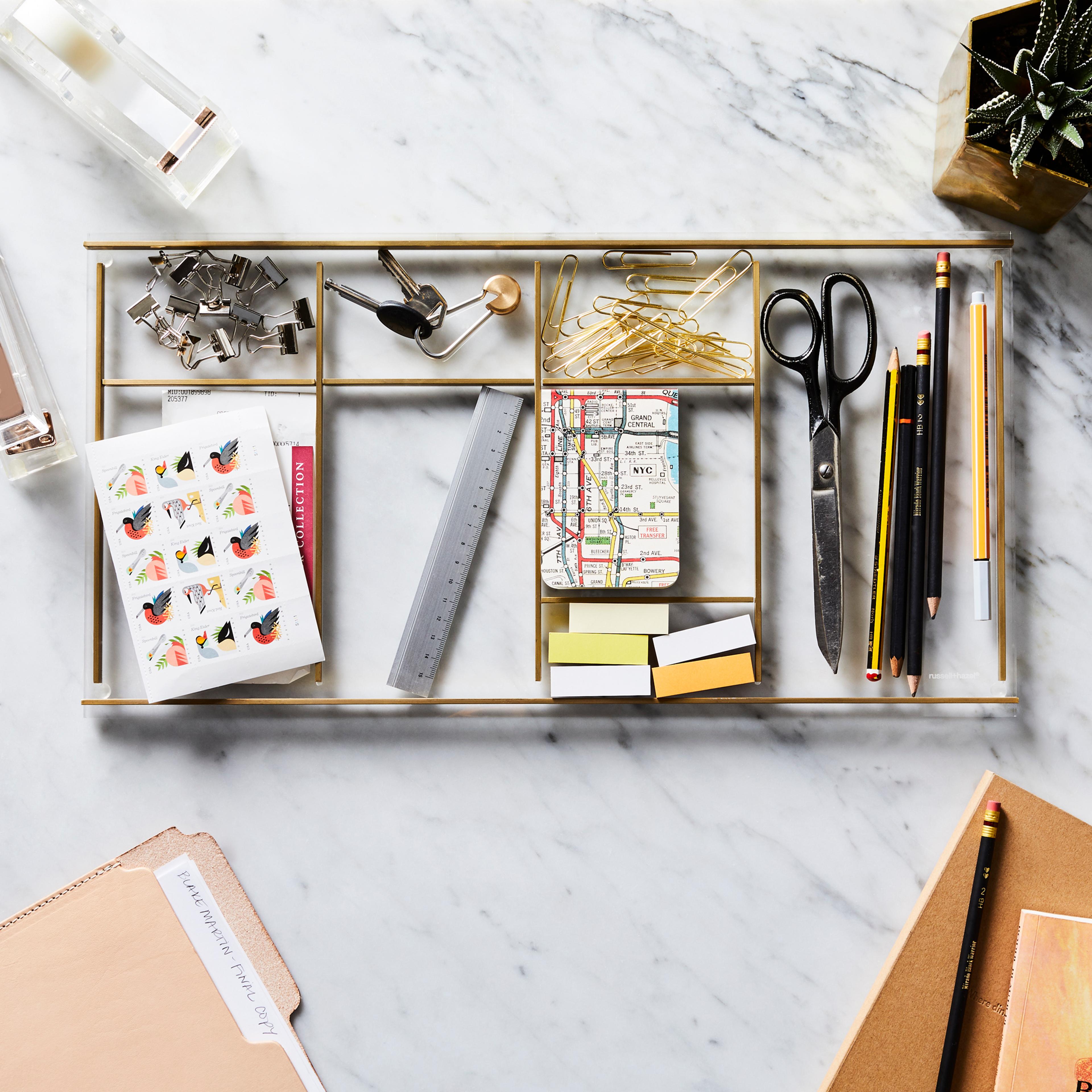 desk supplies like stapler, tape, and scissors on desk
