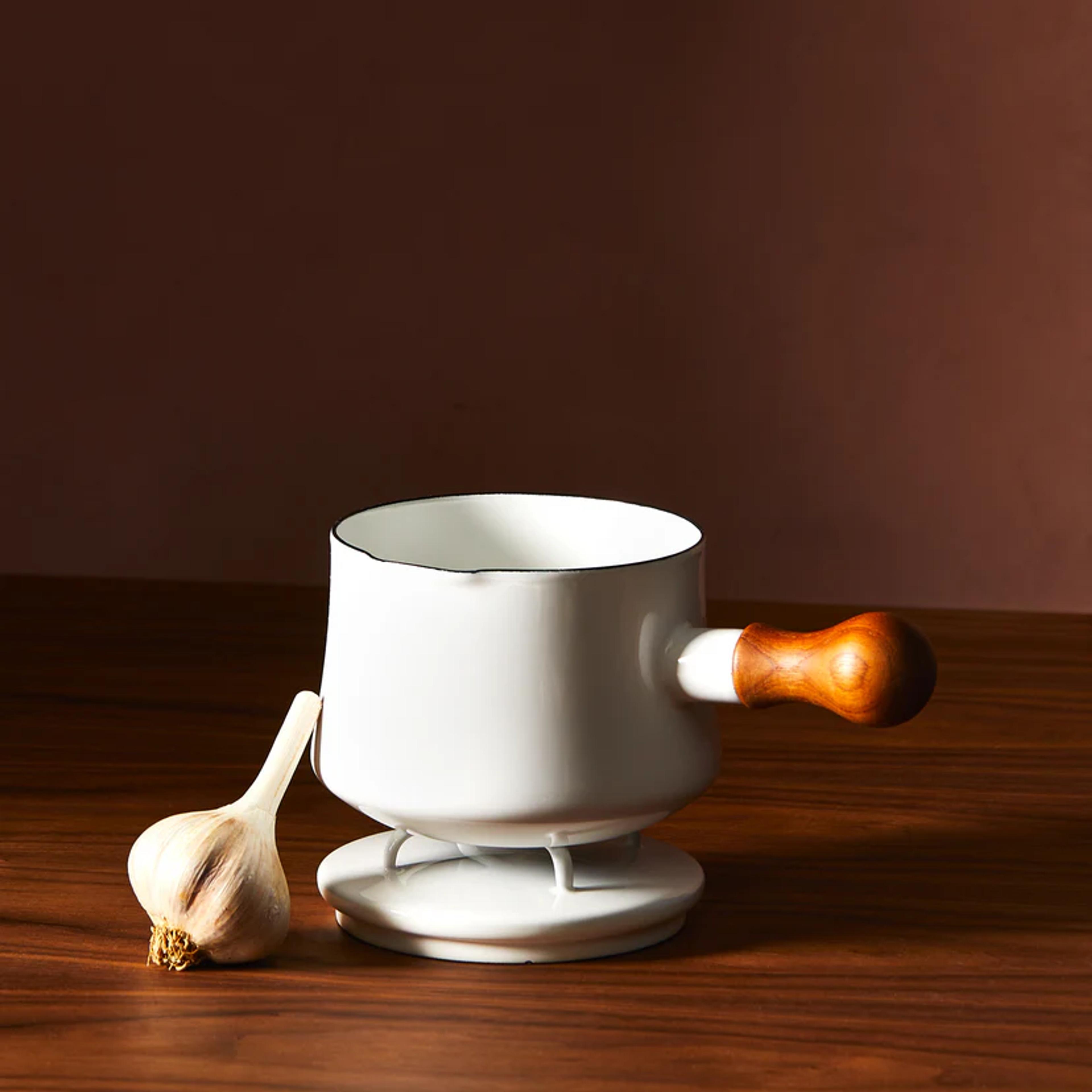 white butter warmer with garlic