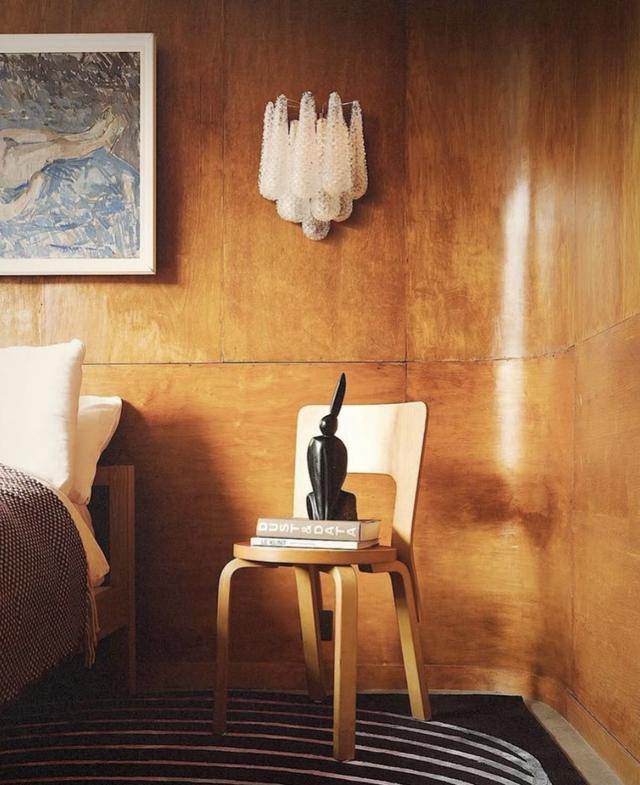 light on wood-paneled wall