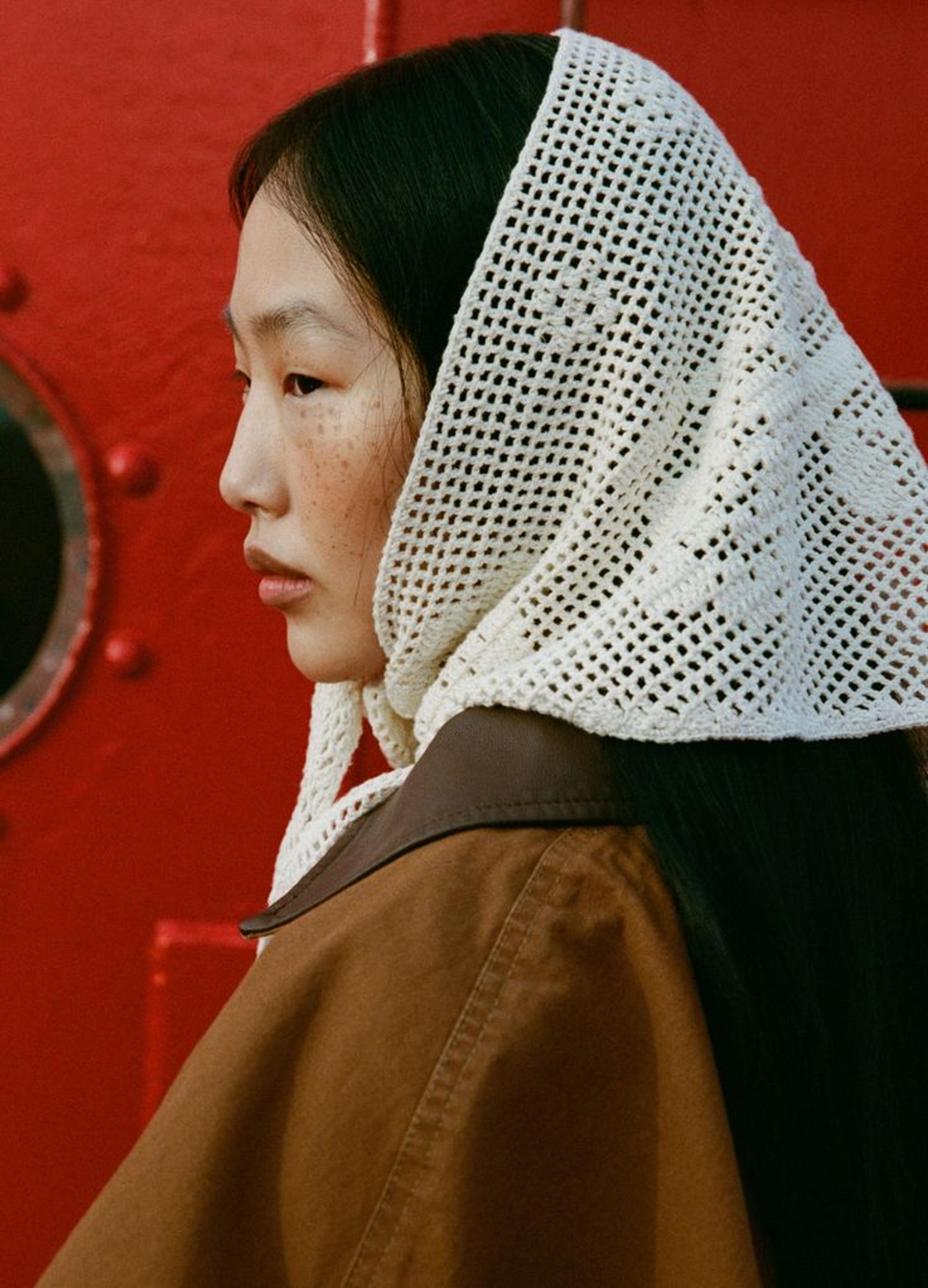 woman with crochet hair scarf