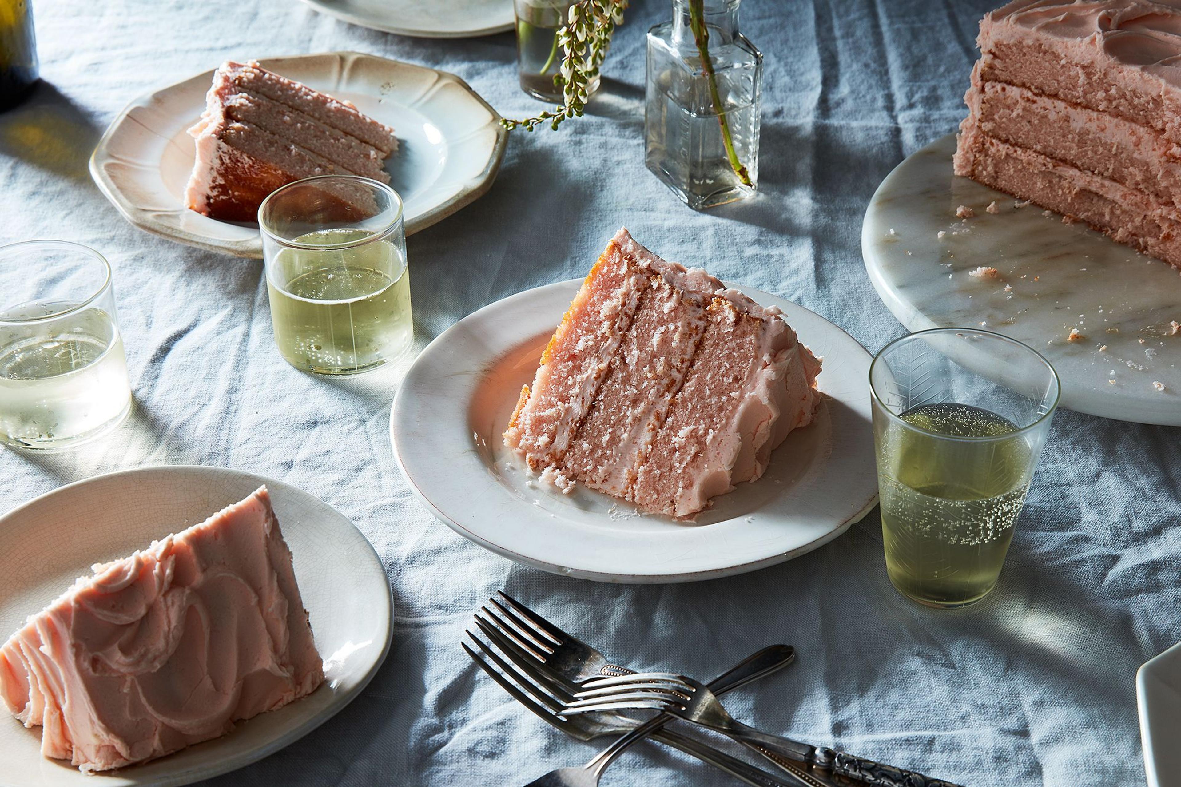 slices of pink champagne cake on table