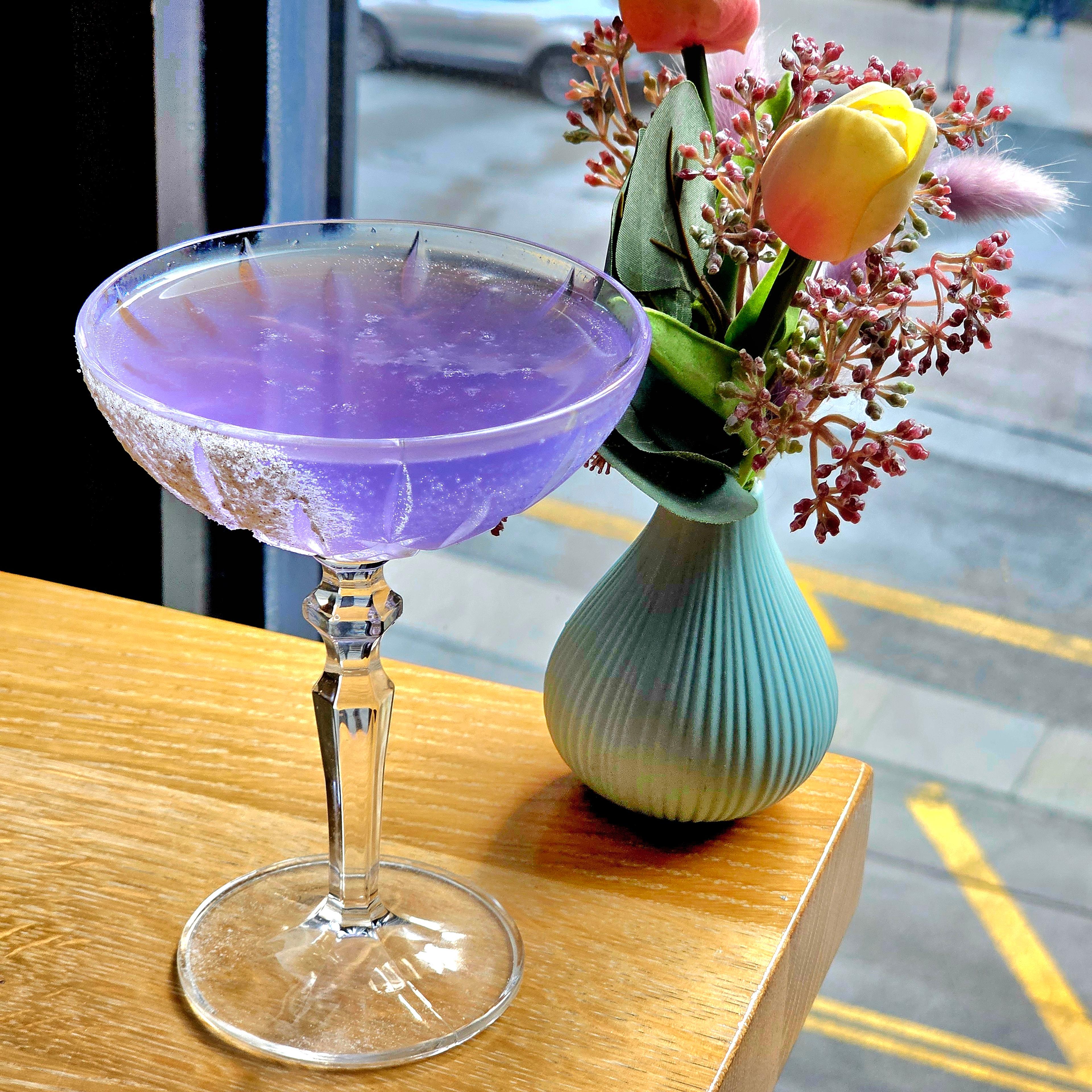purple spooky cocktail in coupe class in the Langham Chicago