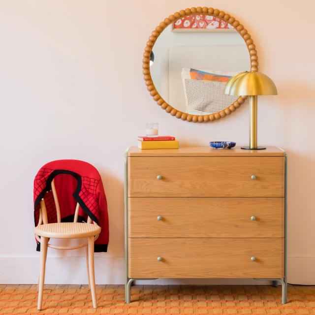 dresser in bedroom with side chair and mirror from Schoolhouse