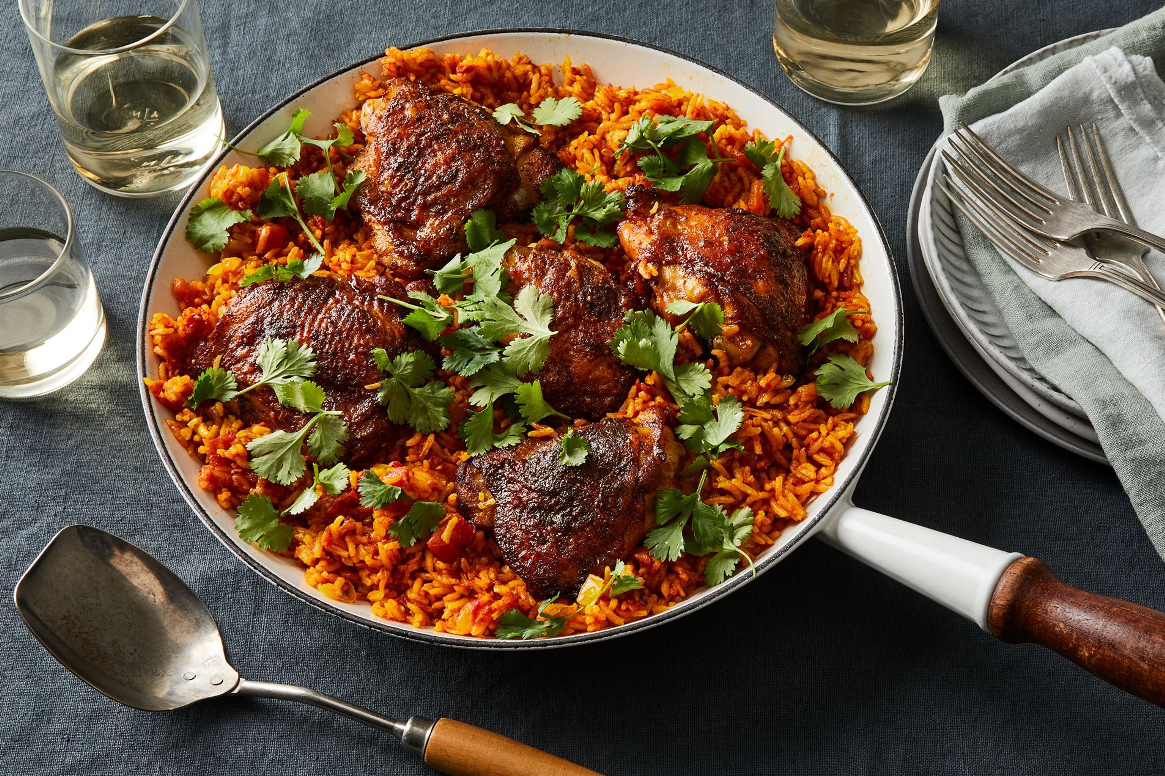 Plated turmeric chicken and rice.