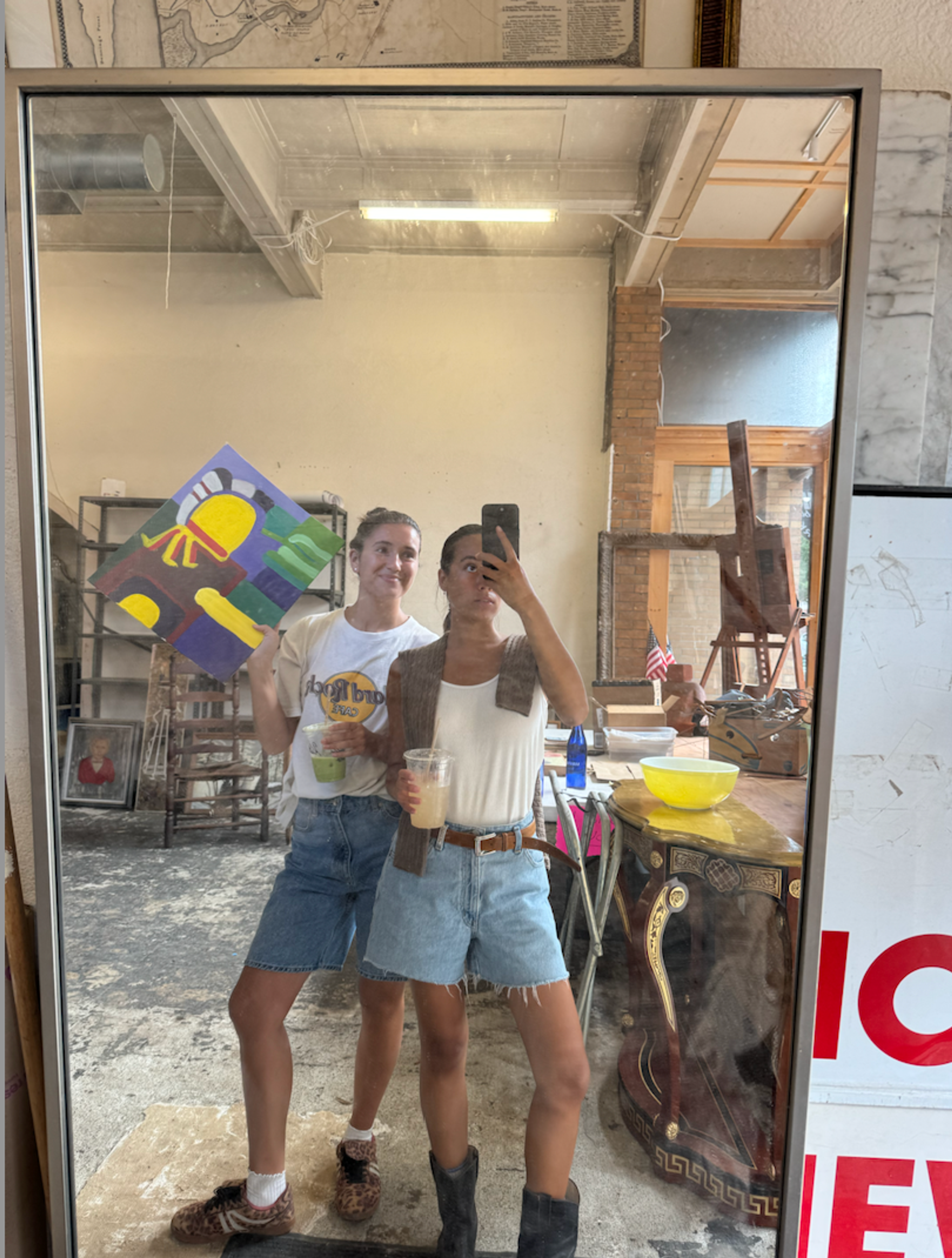 Estro studio owners posing in mirror selfie