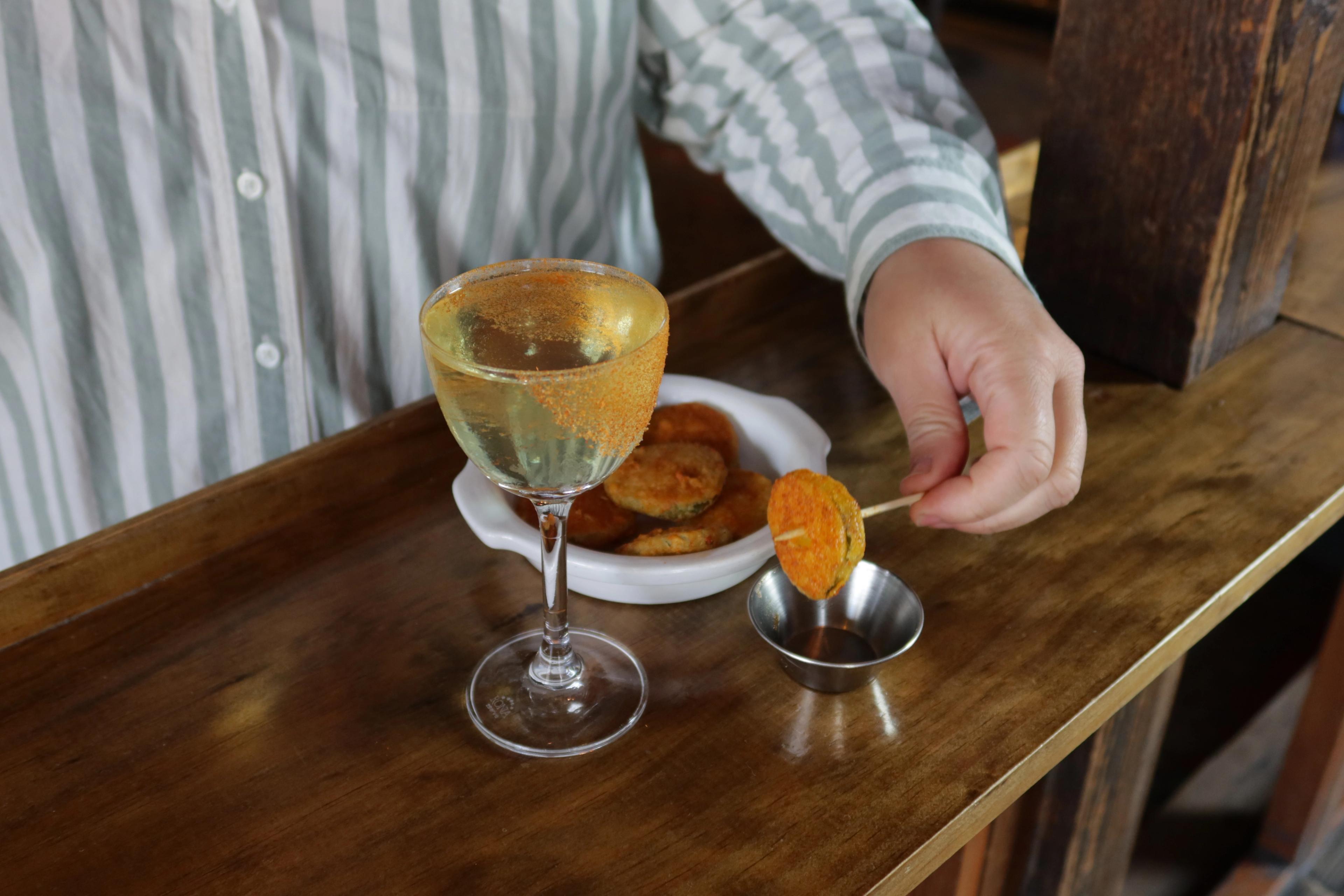 fried pickle martini in a coupe at Porchlight bar in NYC