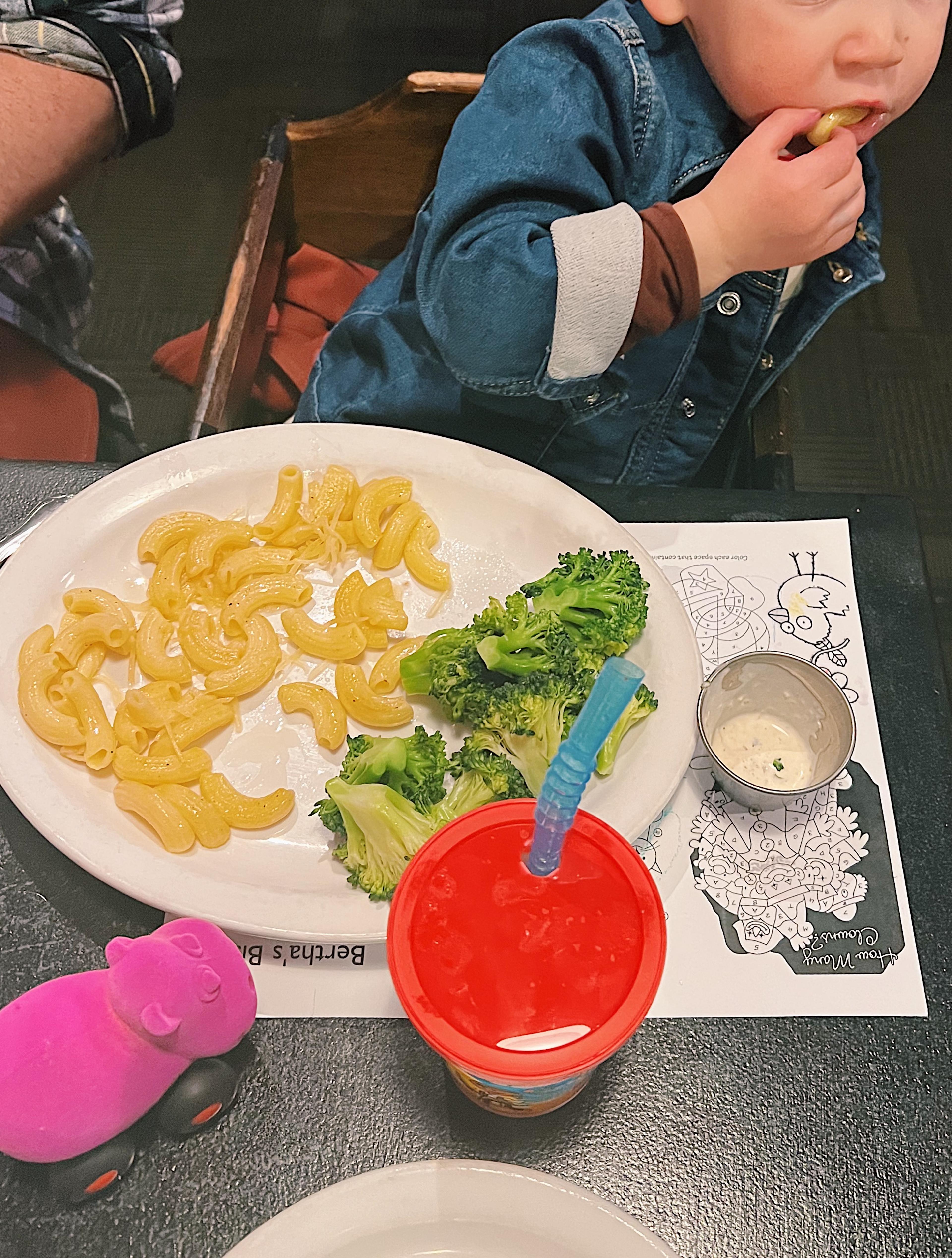 kid drawing at table