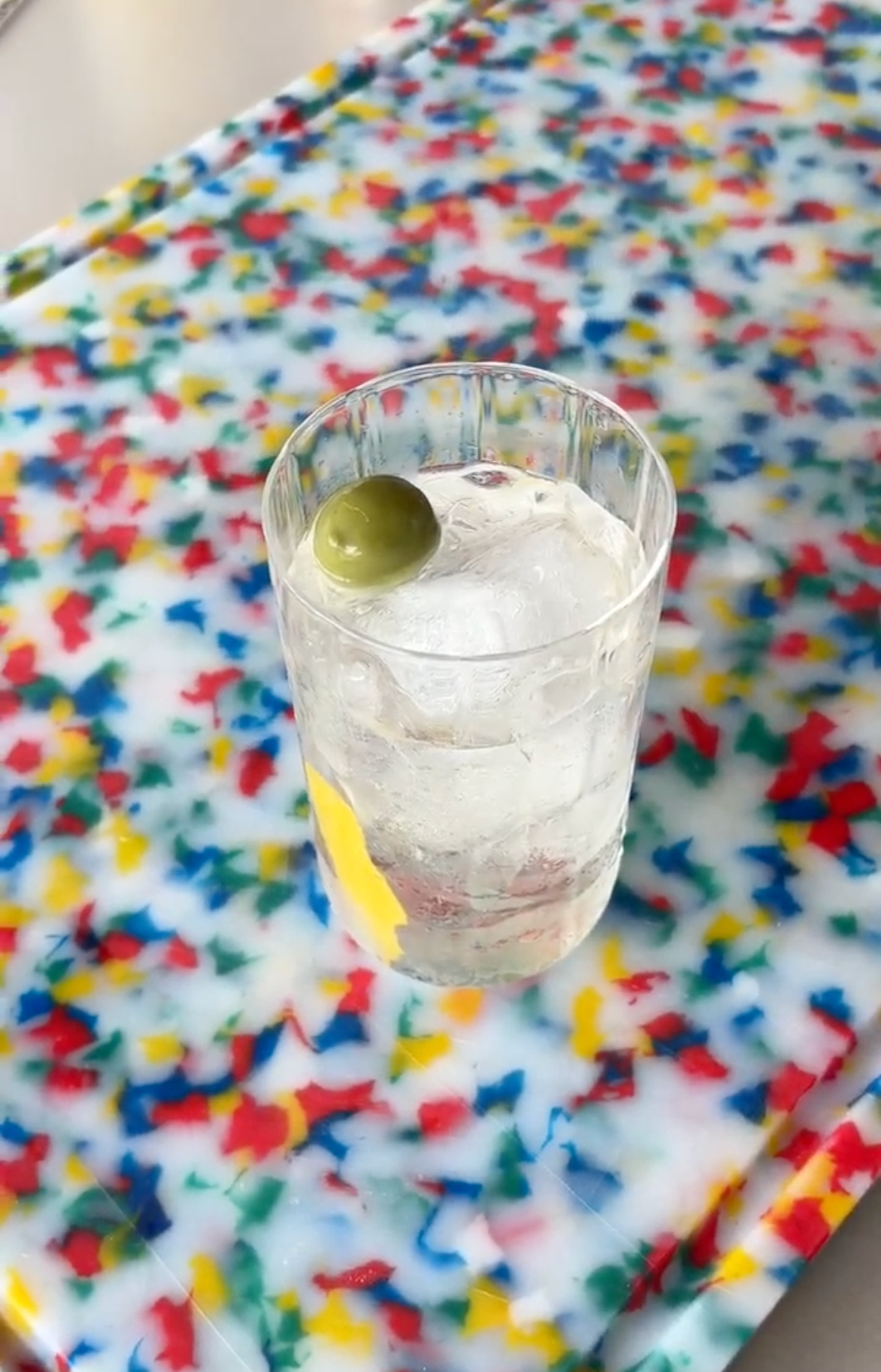 dirty martini tonic in highball glass