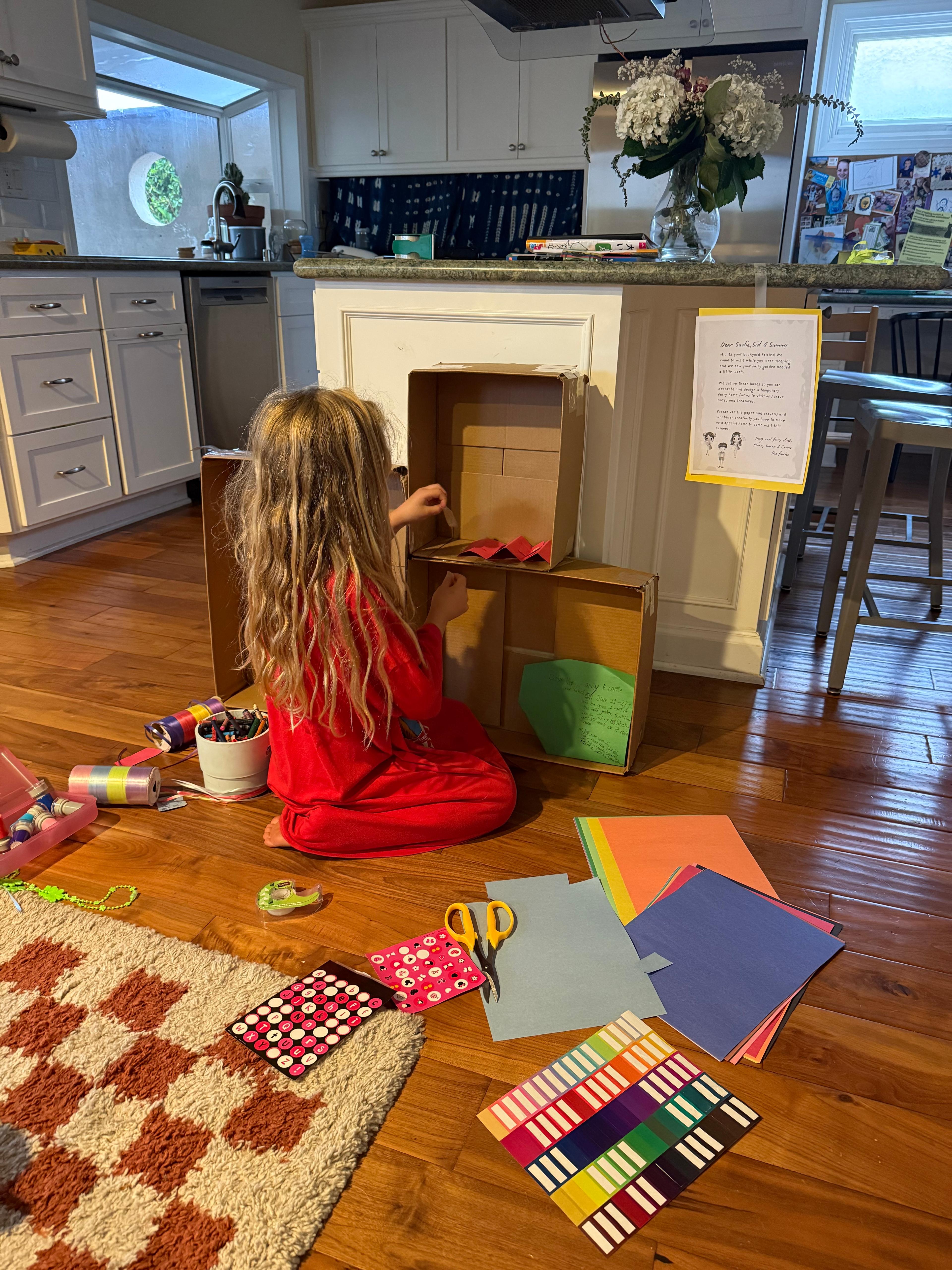 kids playing with fairy cardboard castle craft