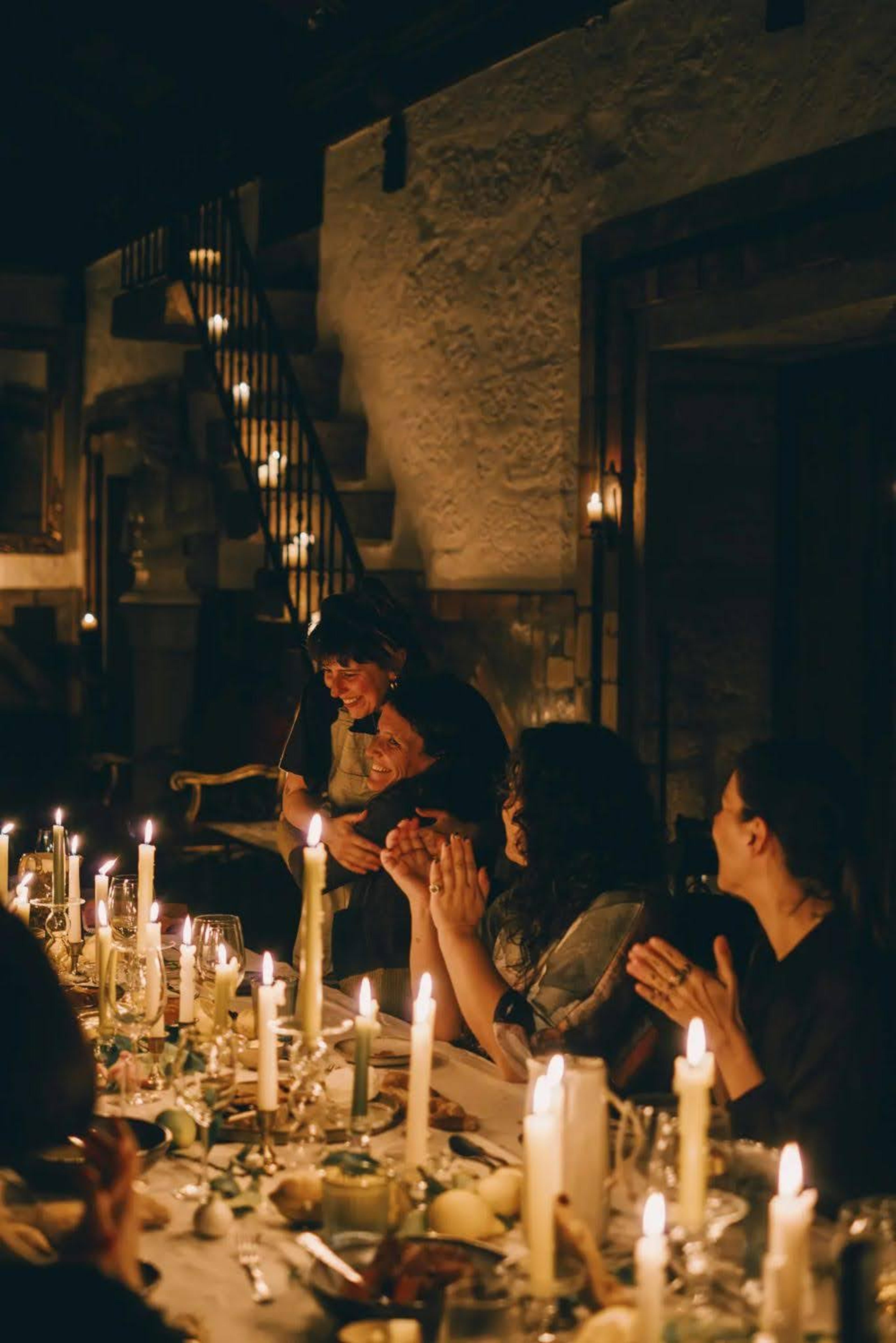 people at long dinner party table