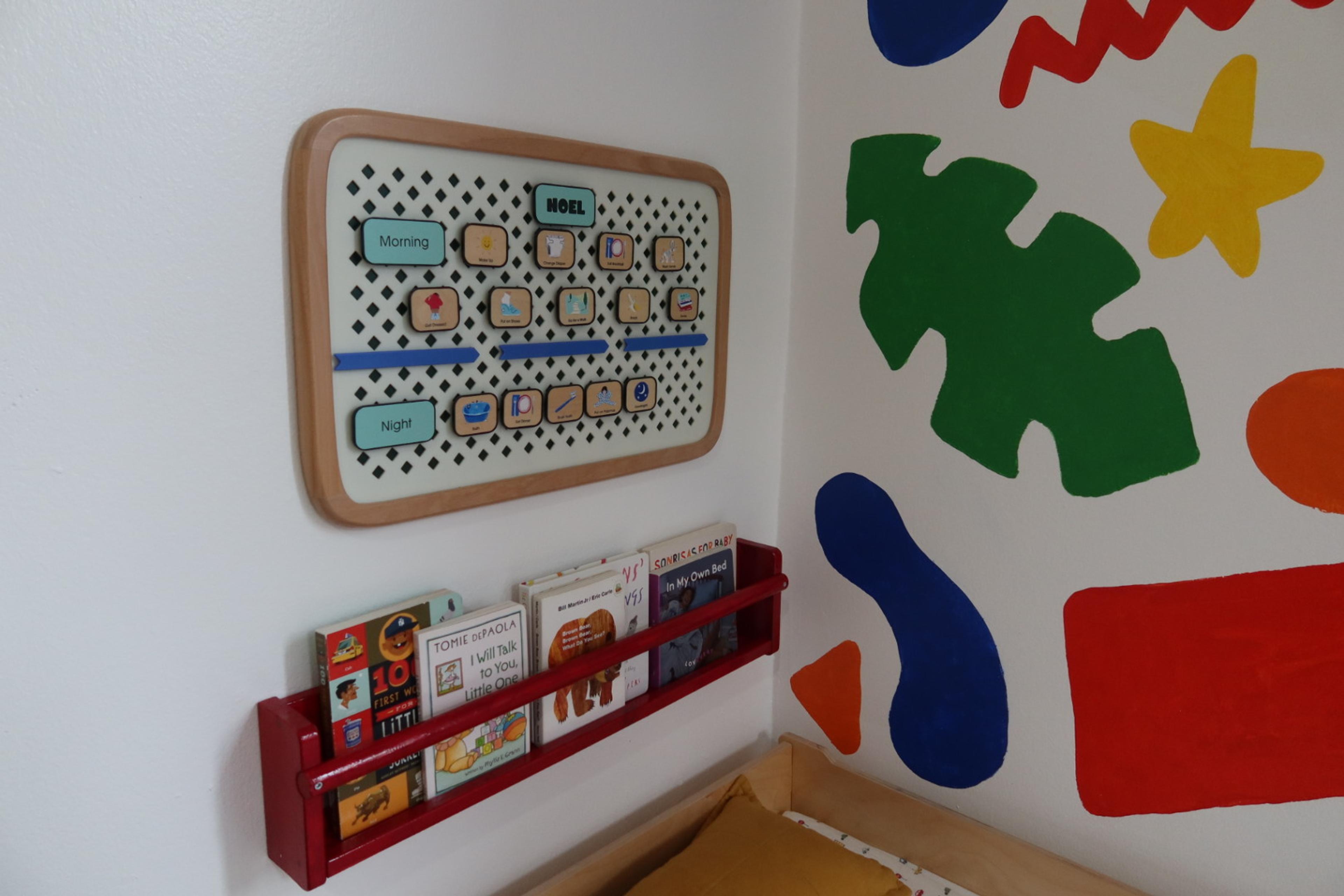 painted wall and hanging calendar in nursery section of primary bedroom