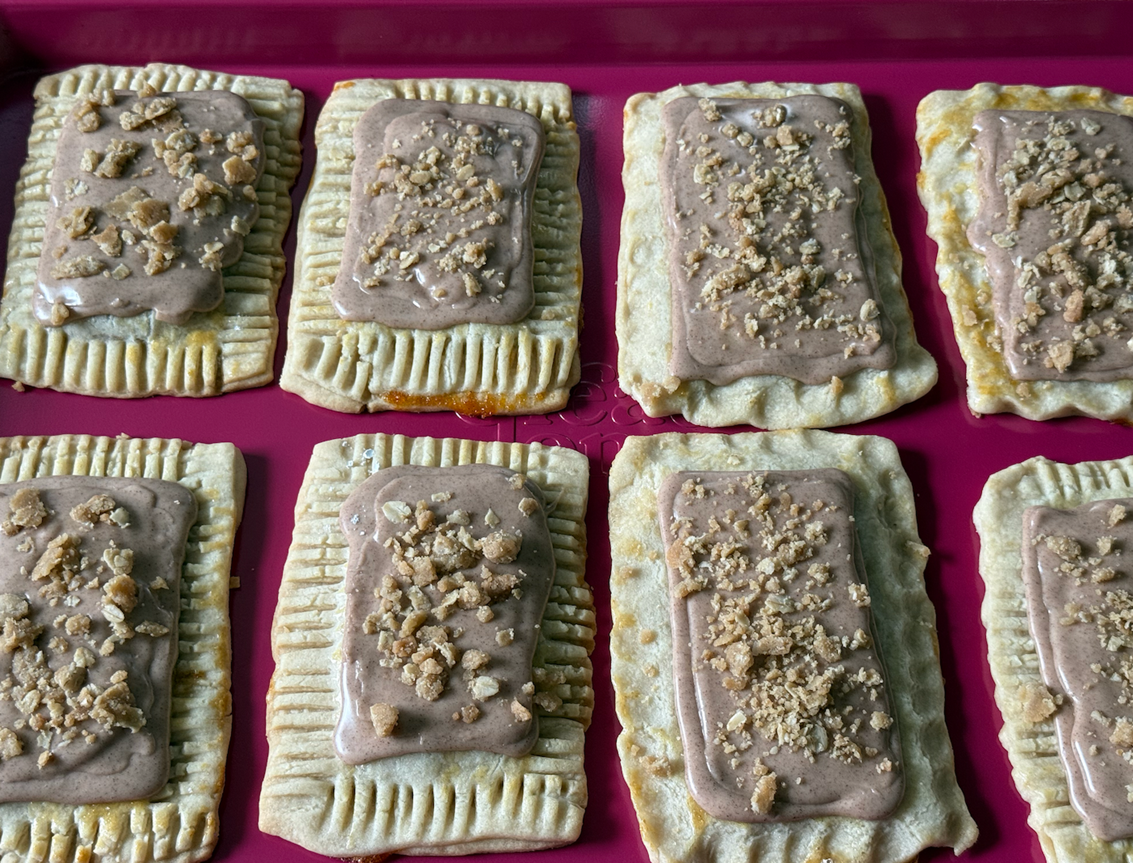8 poptarts on a pink pan