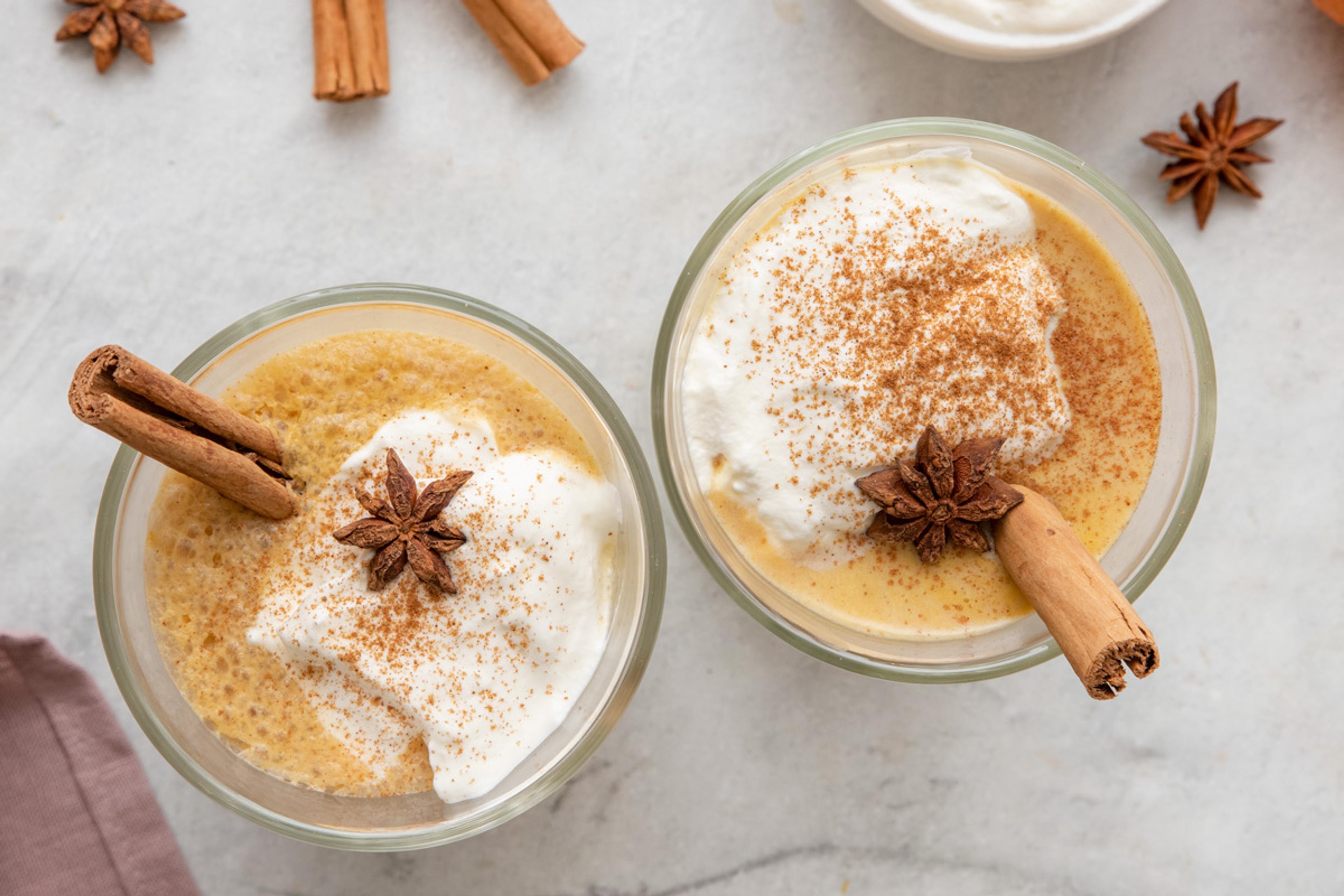 two mugs of homemade pumpkin spice lattes