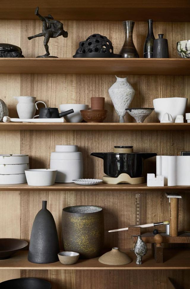 pottery lined up on shelves