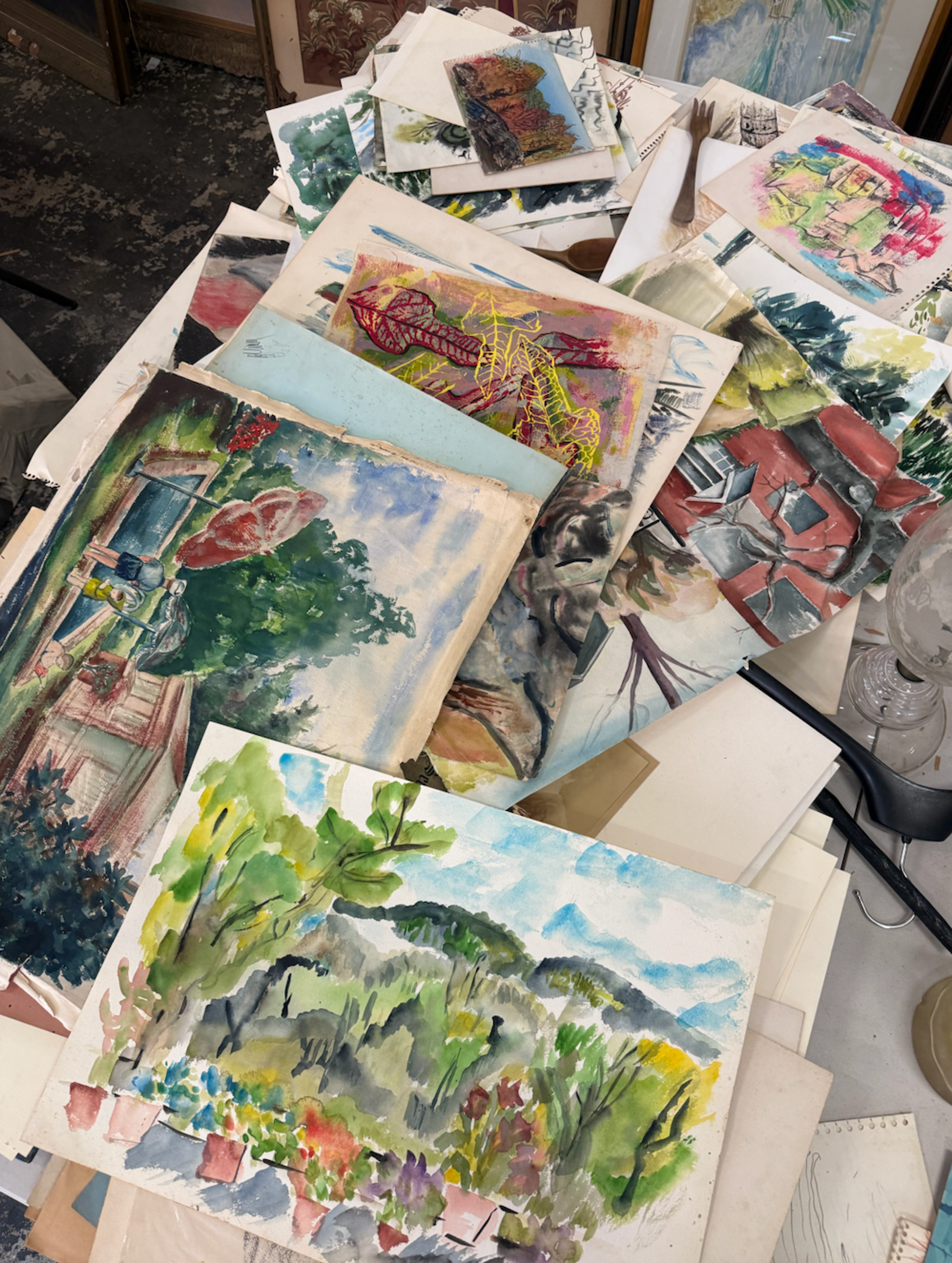 pile of thrifted paintings