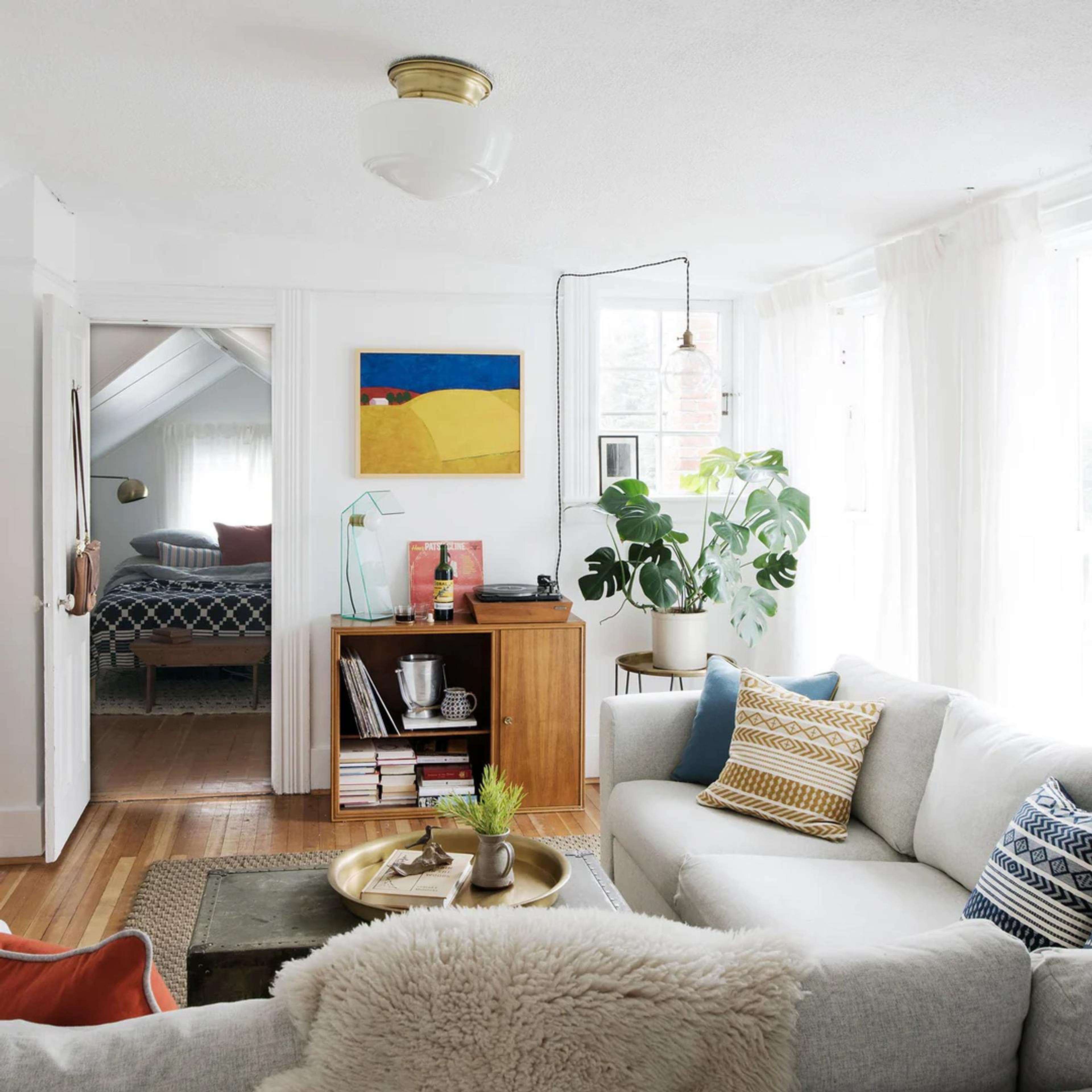 living room rentals with couch, bookshelf, windows, etc