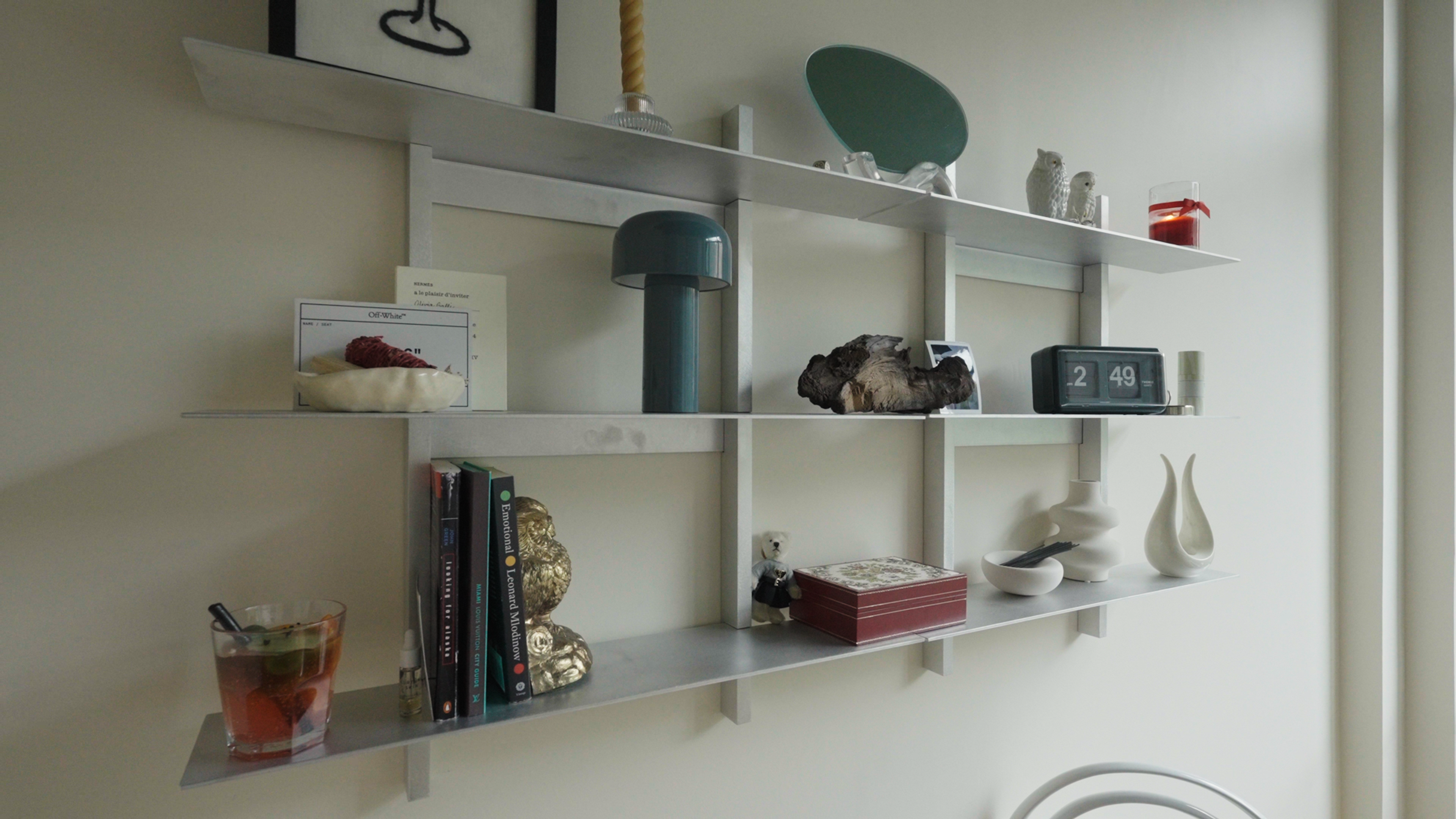 shelf with collected items in Olivia Galli's NYC apartment