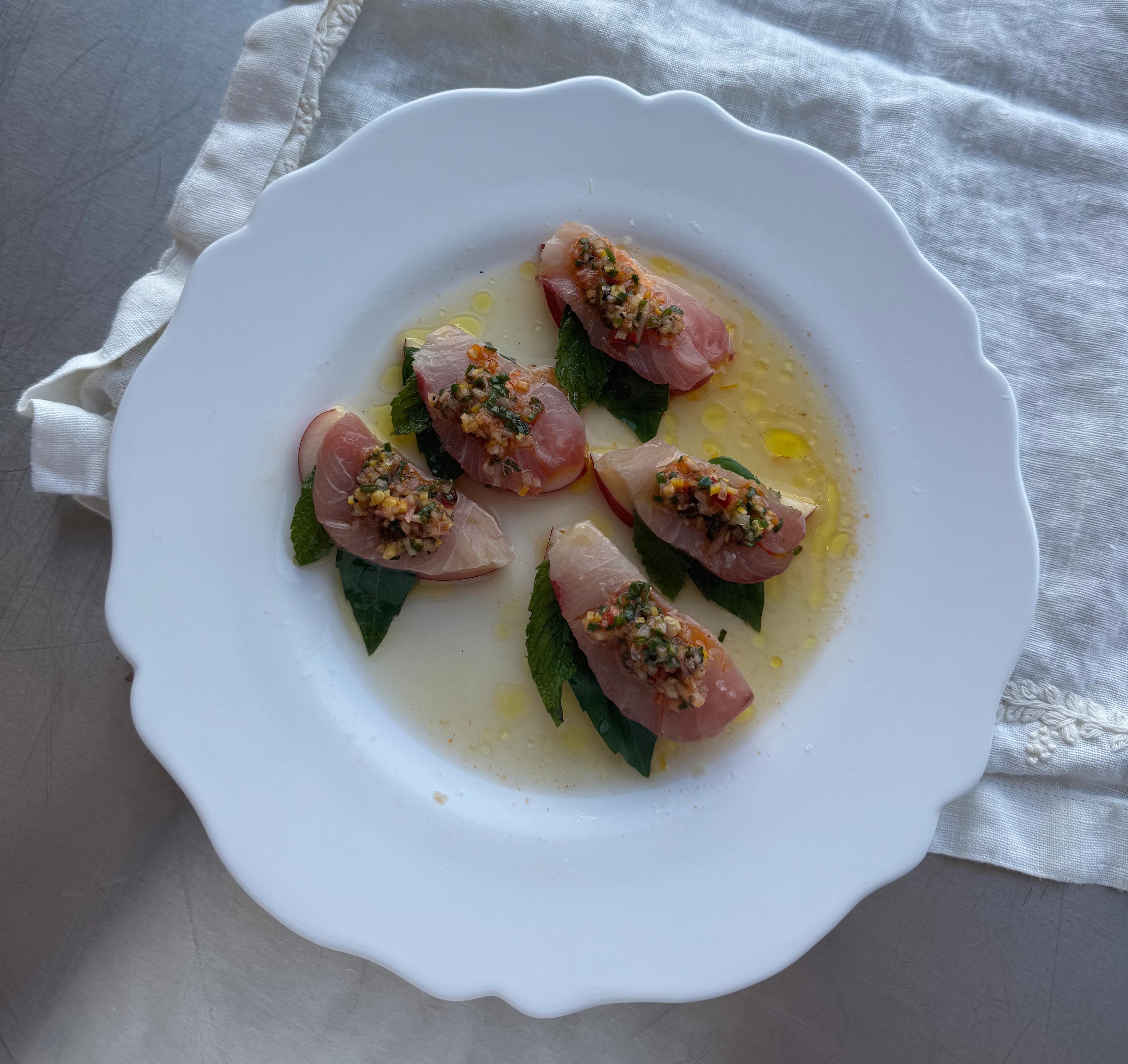 A plate of yellowtail crudo with nectarine and meyer lemon relish