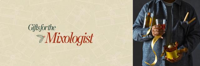 person wearing a flannel holding a cocktail glass, cruet, and more cocktail gifts