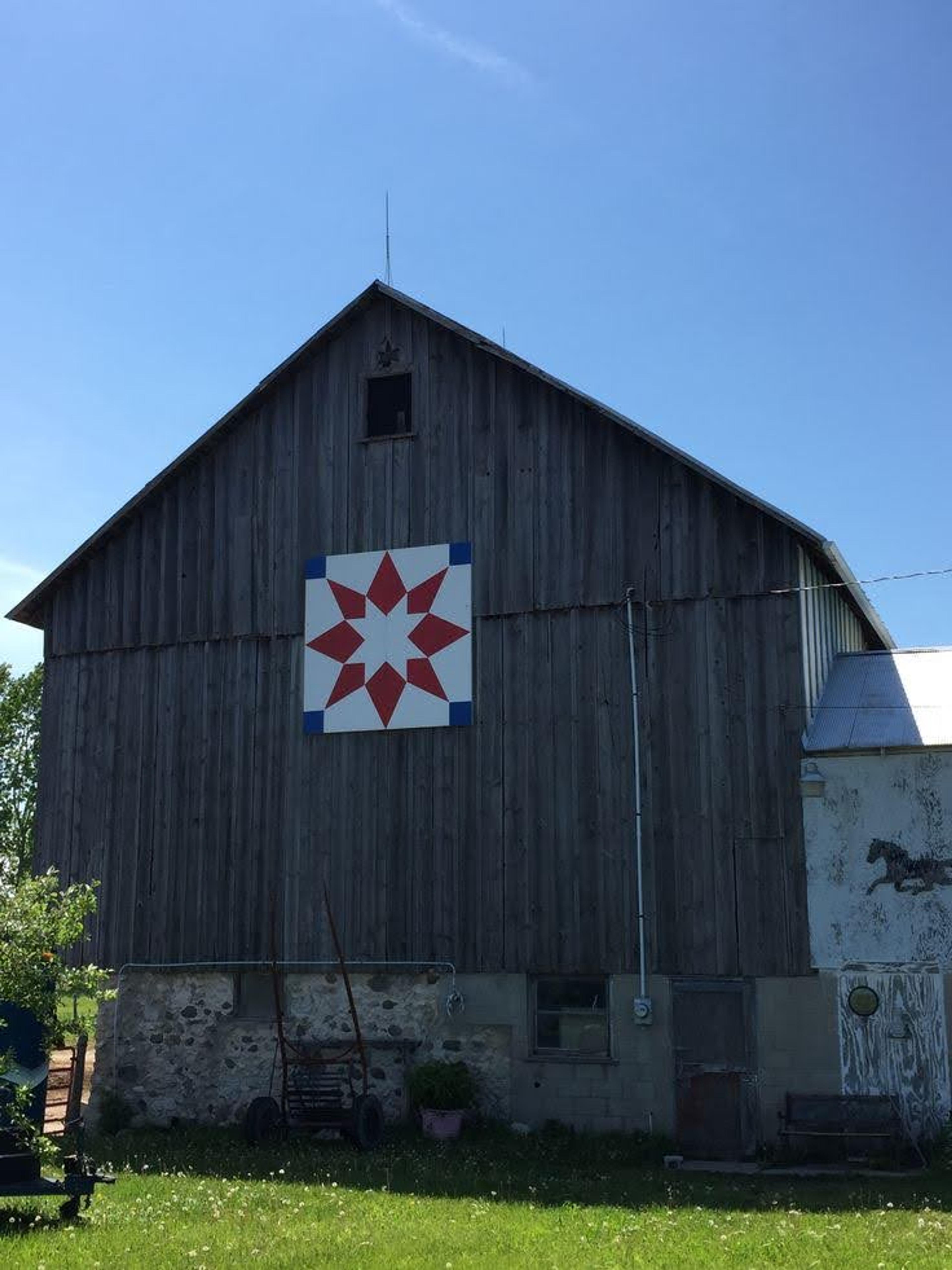 barn with quilt like patch