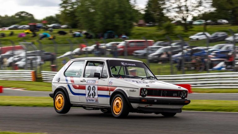 Period-correct motorsport graphics applied to a race vehicle.