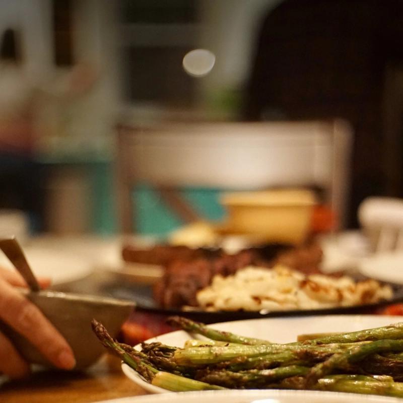 Plates of food shared around a table