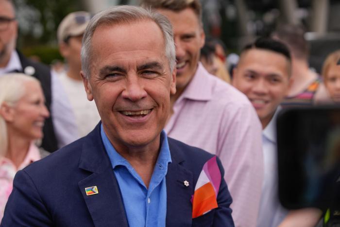 Canadian prime minister Mark Carney speaking at a podium
