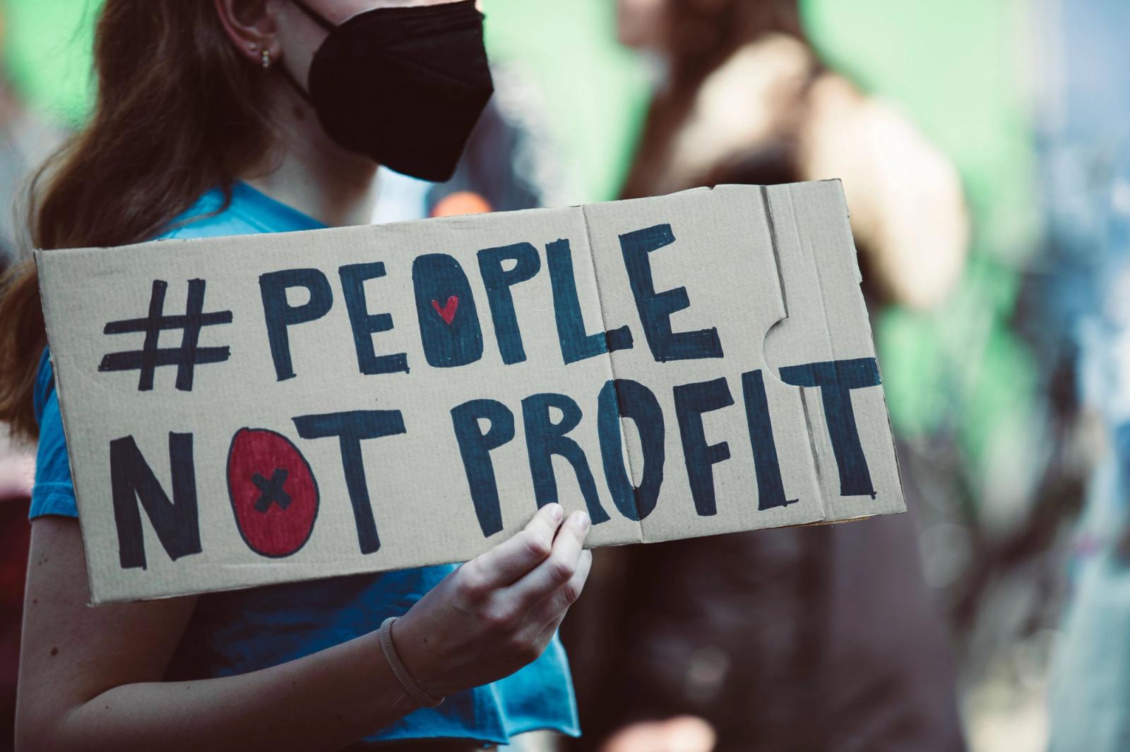 Young protester holding a sign at a rally