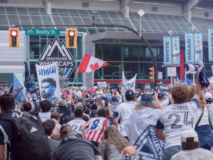A photo of Vancouver Whitecaps fans celebrating outside BC Place from a Canadian unbiased news source