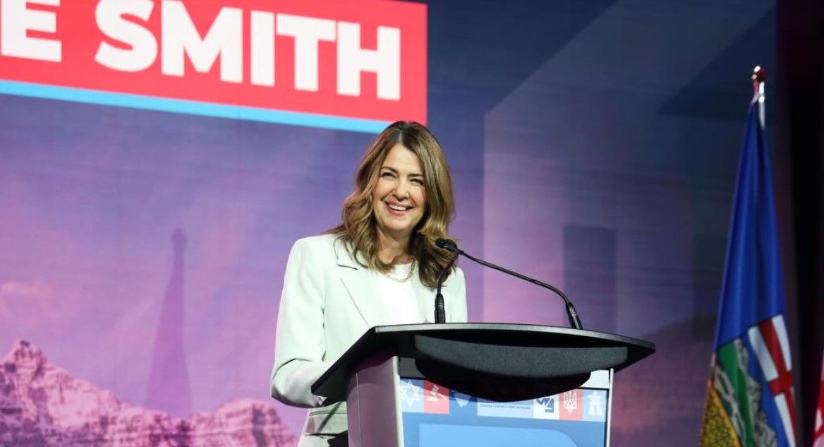 Alberta Premier Danielle Smith speaking at a podium