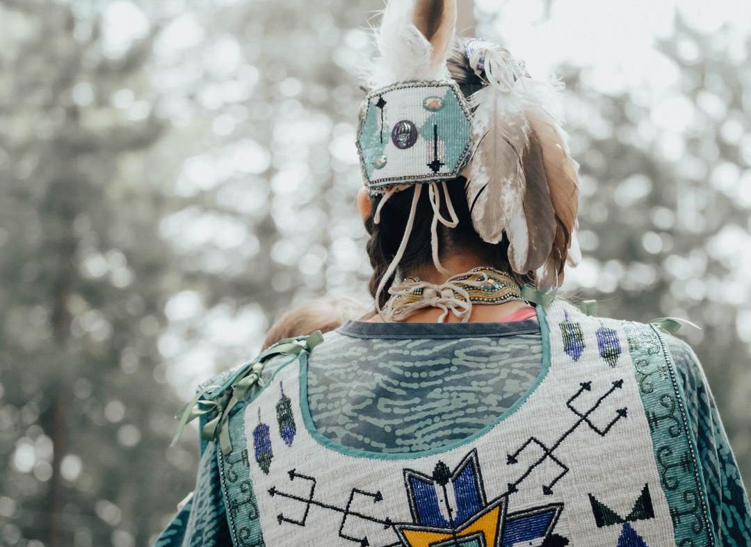 A member of the Wolastoqey Nation wearing traditional clothing