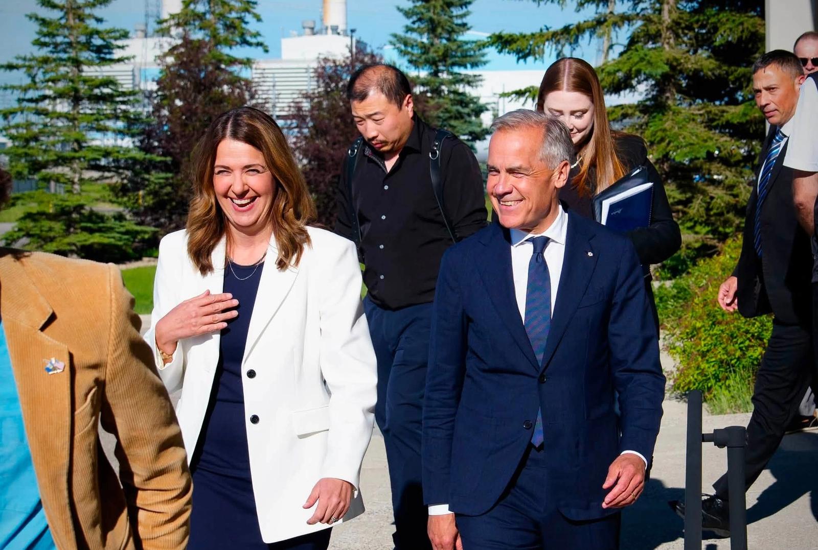 Alberta Premier Danielle Smith standing alongside Prime Minister Mark Carney