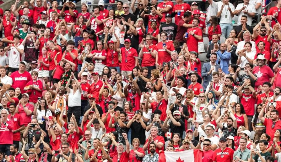 Canadian fans in the stands of BC Place, cheering for their team