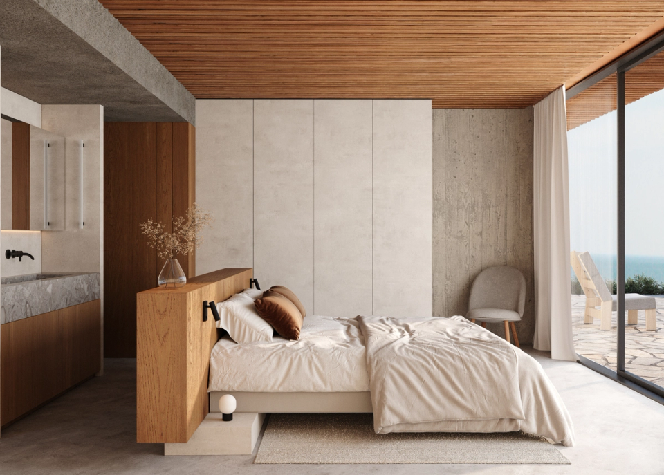 Bedroom of the detached house conceived as a warm and minimalist space, with natural materials, soft textures, and a direct relationship with the outdoors. Large openings and Mediterranean light enhance a serene and contemporary atmosphere, open to the landscape and everyday comfort.