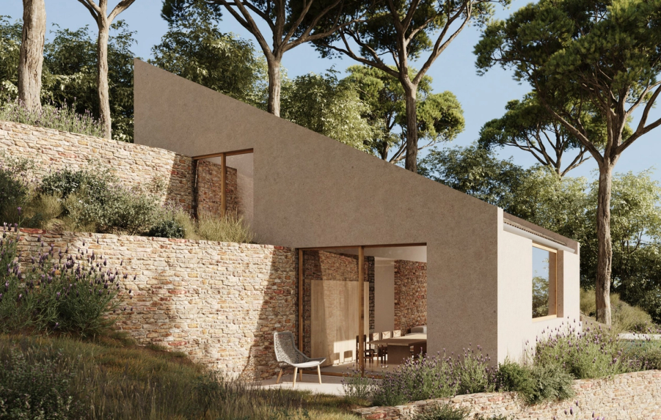 "House in Tamariu naturally integrated into a sloping site, featuring contemporary architecture that combines stone walls, clean volumes, and large openings towards the Mediterranean landscape. The project takes advantage of the different terraces of the terrain to create a fluid connection between interior, exterior, and nature.