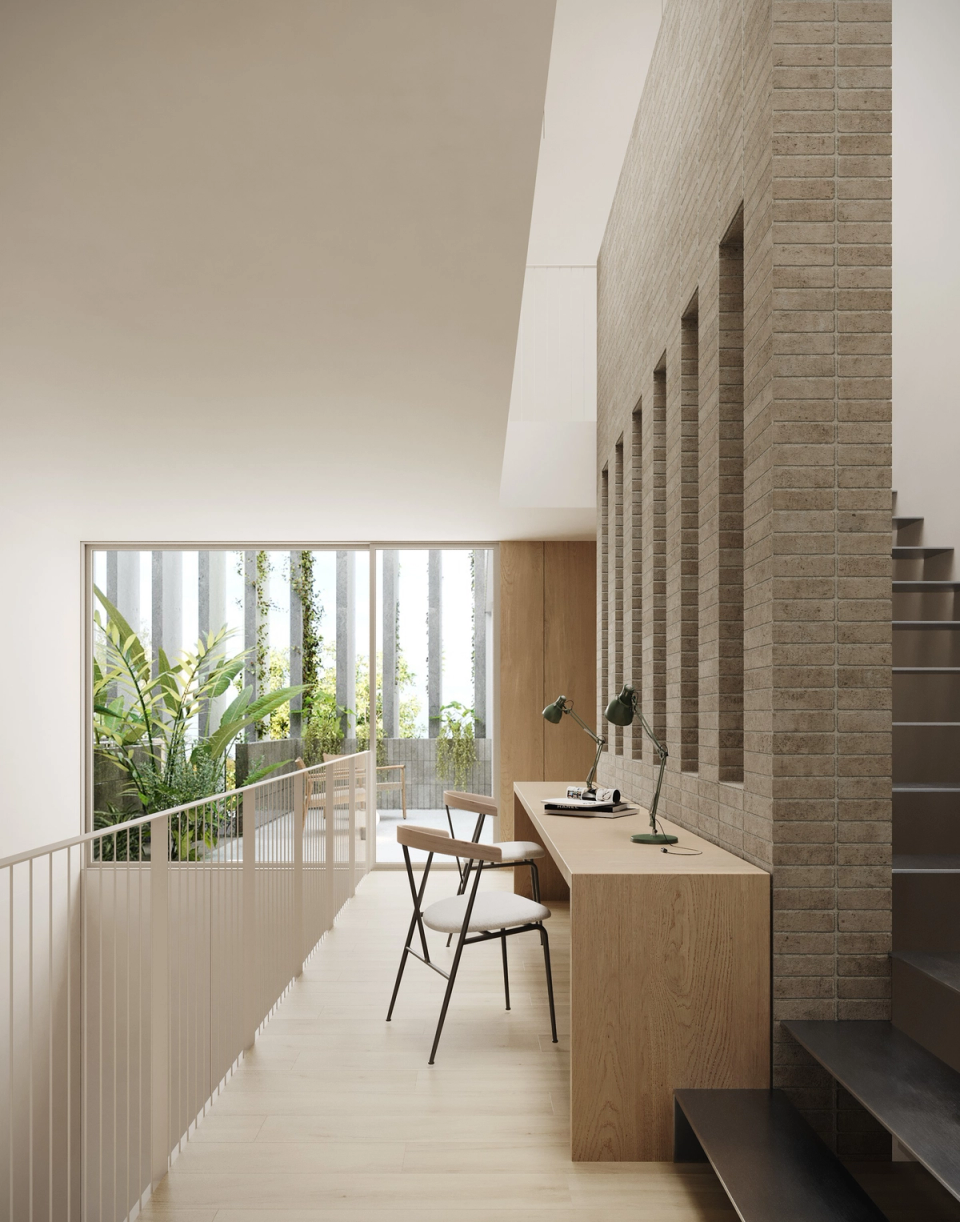 Houses in Bescanó with open interior spaces and work areas illuminated by natural light coming from the central courtyard. These houses in Bescanó combine warm materials, natural textures, and contemporary architecture designed to enhance comfort and visual connection between spaces.