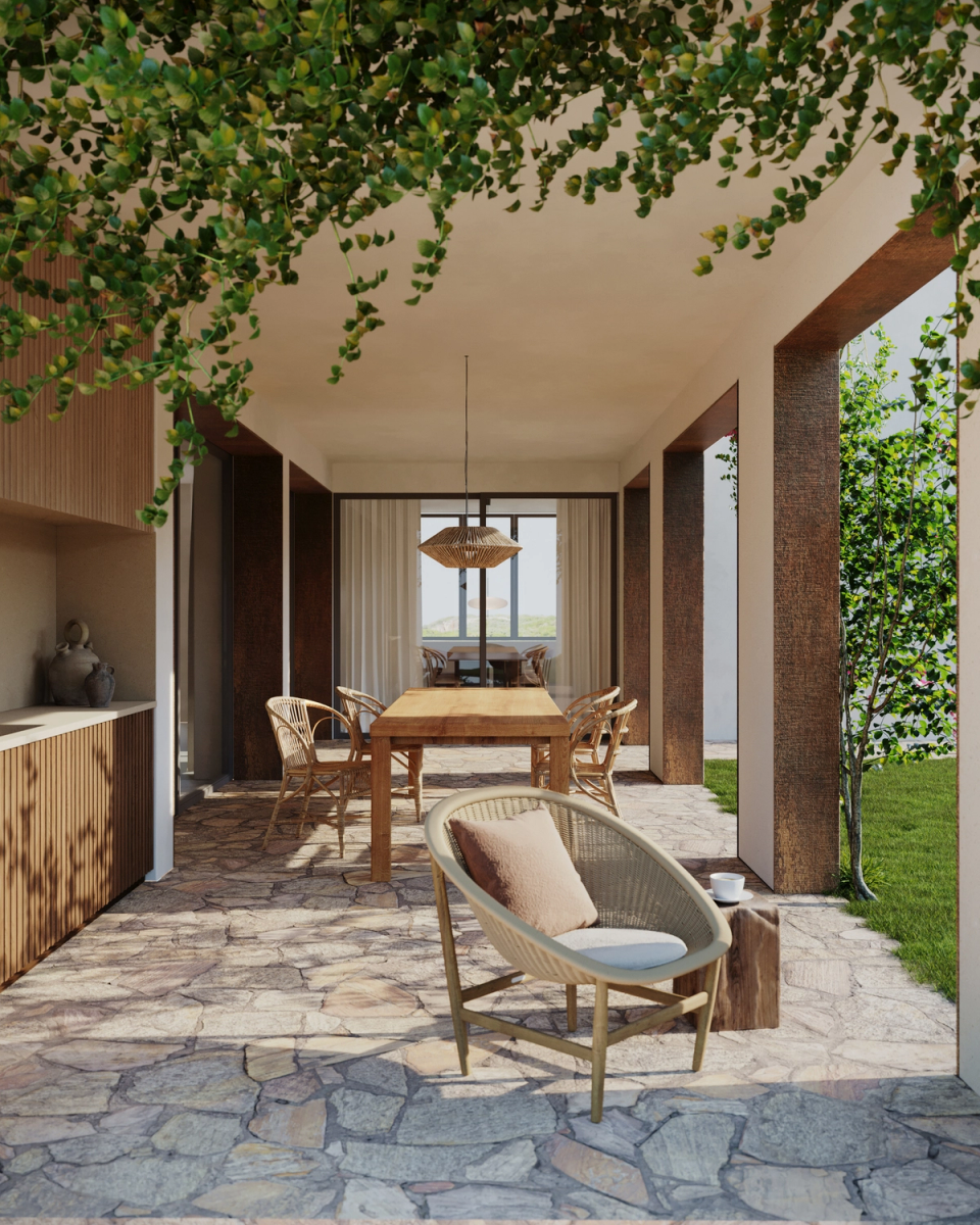 This renovation and extension project redefines the outdoor spaces of the home through open porches and natural materials that strengthen the connection with the garden. The combination of stone, wood, and vegetation creates a warm and relaxed Mediterranean atmosphere, turning transitional areas into livable spaces designed to enjoy light, shade, and outdoor living.